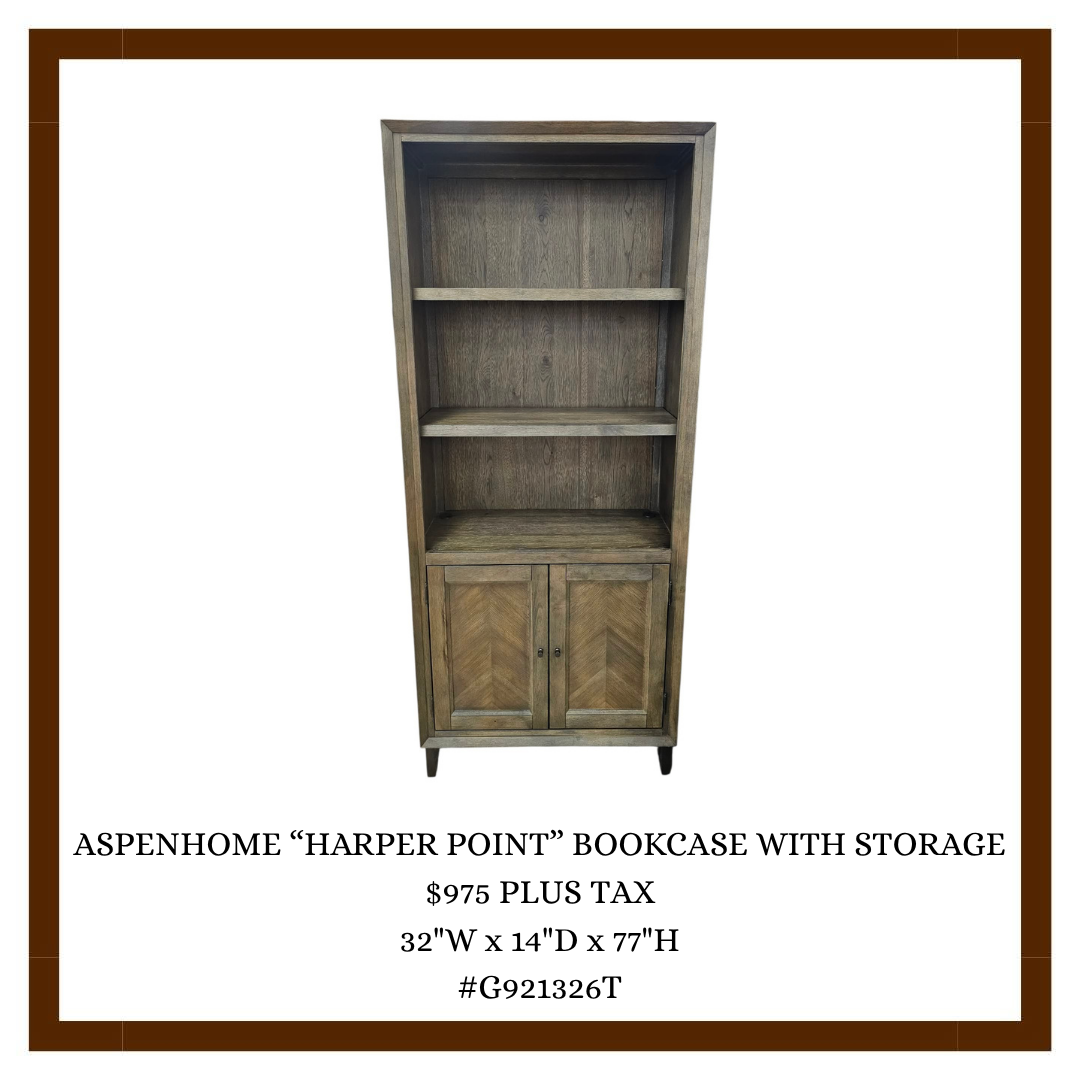 Wooden bookcase with storage, featuring open shelves and two closed cabinet doors at the bottom.