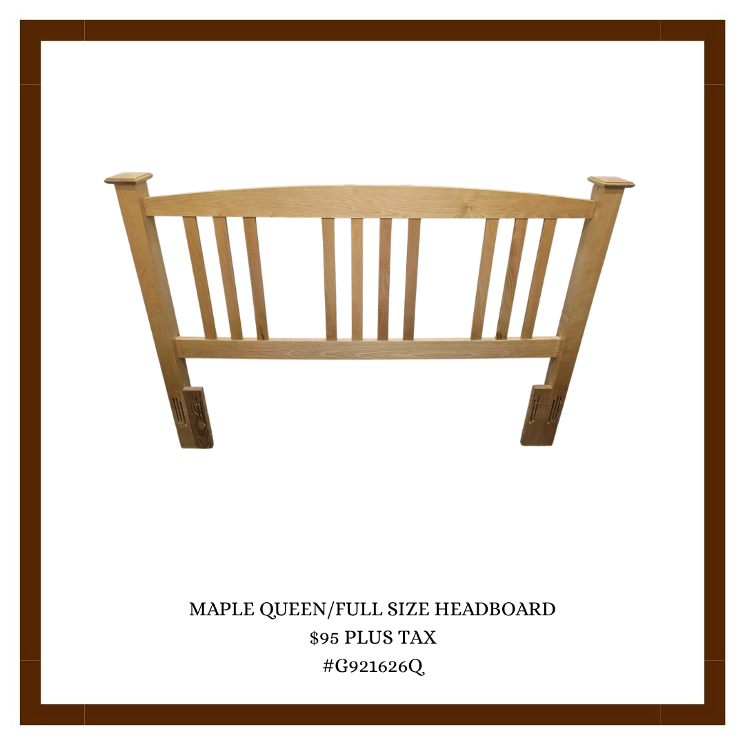 Full size maple queen headboard with vertical slats and slanted top.