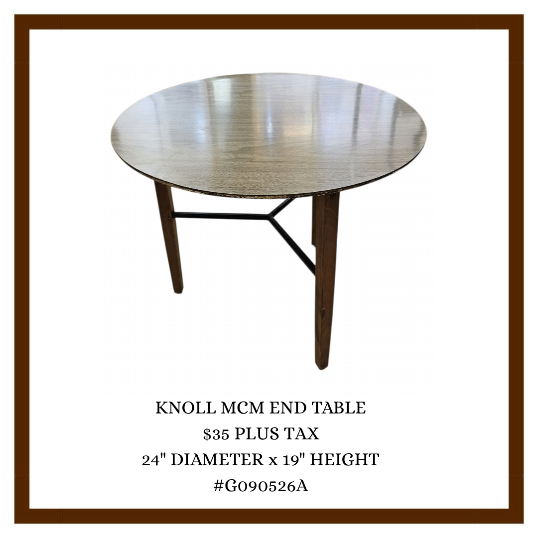 A wooden round end table with a metal support structure.