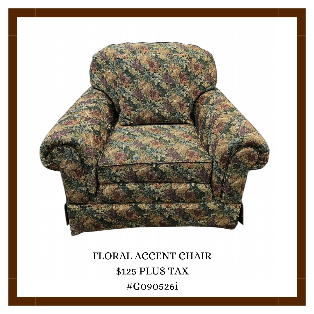 A floral patterned accent chair with padded armrests and a matching back cushion, priced at $125 plus tax.