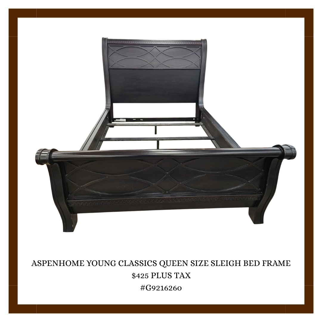 Black queen size sleigh bed frame with ornate curved headboard and footboard, displayed on a white background.