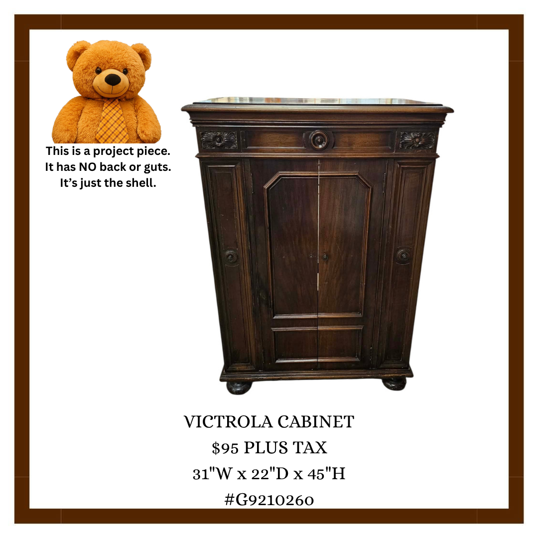 Auction listing for a Victrola cabinet with a dark wood finish, measuring 31 inches wide, 22 inches deep, and 45 inches high. It is priced at $95 plus tax. The photo includes a plush teddy bear wearing an orange checked tie, pointing to the cabinet a