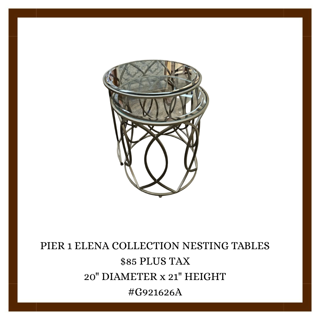 Two nesting tables with glass tops and metal bases, decorative design, from the Pier 1 Elena Collection.