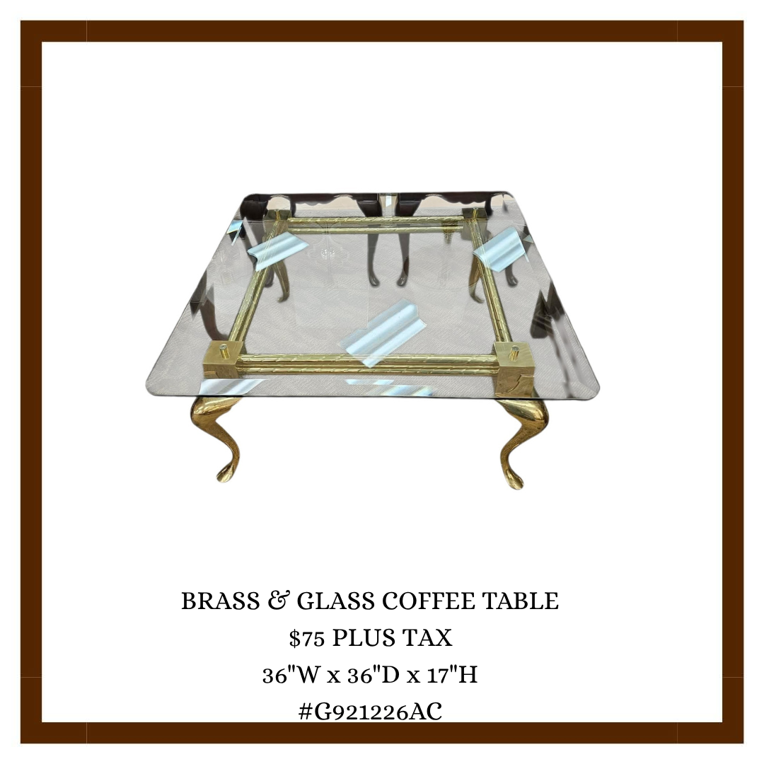 A brass and glass coffee table with a square glass top, brass frame, and gold curly legs on a white background in a promotional flyer.