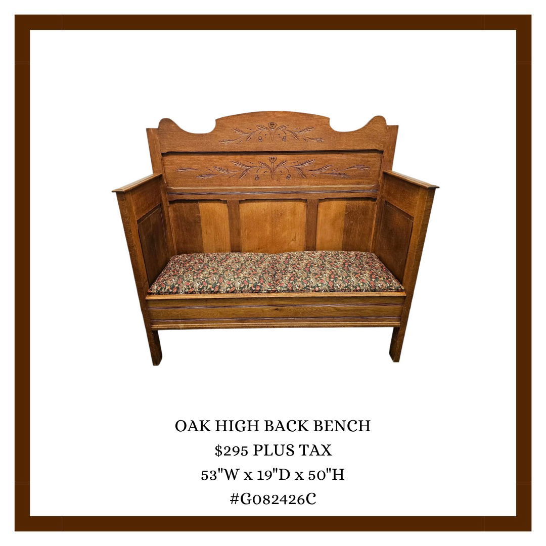 A wooden oak high back bench with floral carvings on the backrest and a cushioned seat with floral upholstery, listed with dimensions and price.