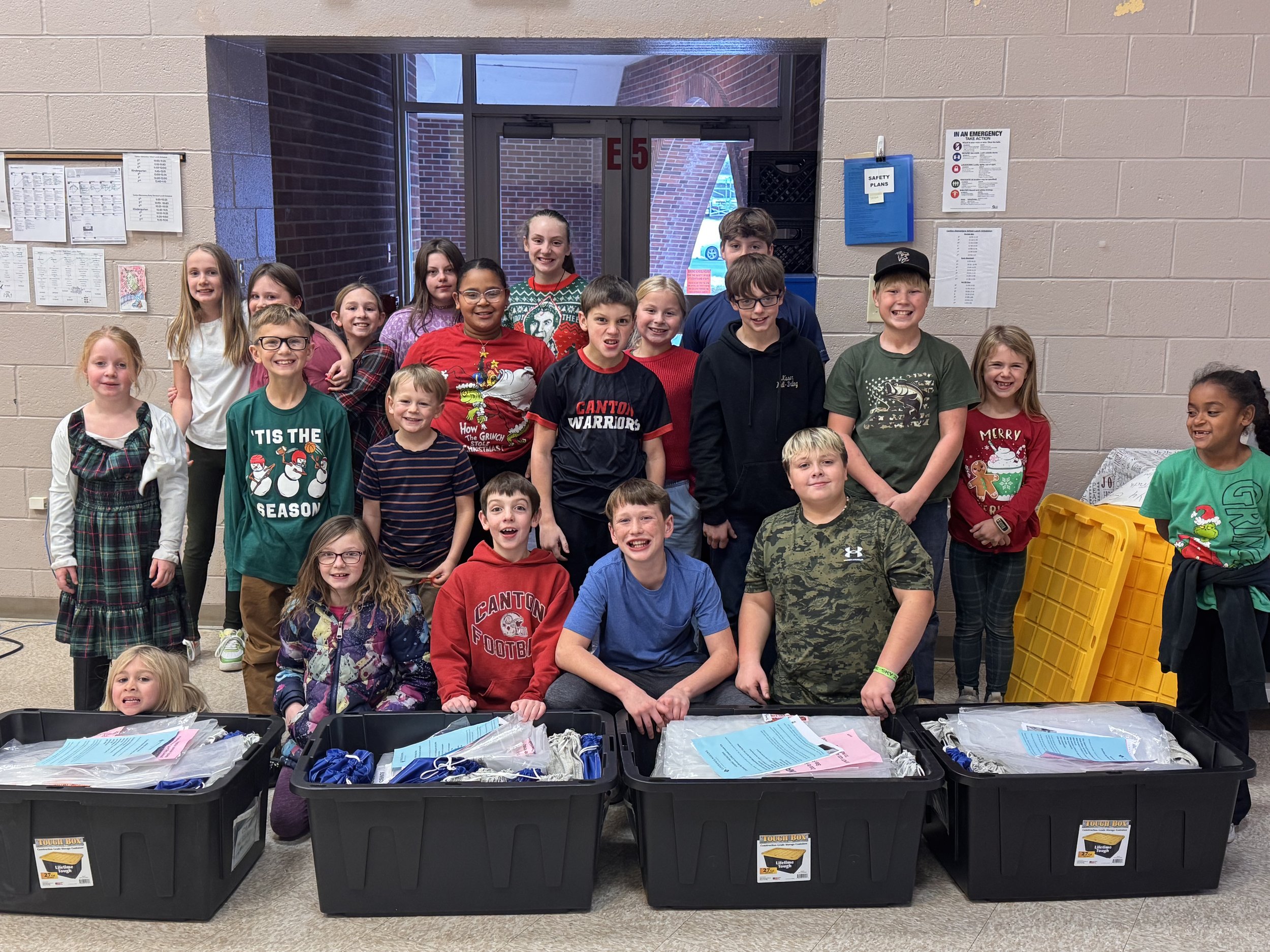 Elementary school children pack ministry aid for children in need in the Middle East.