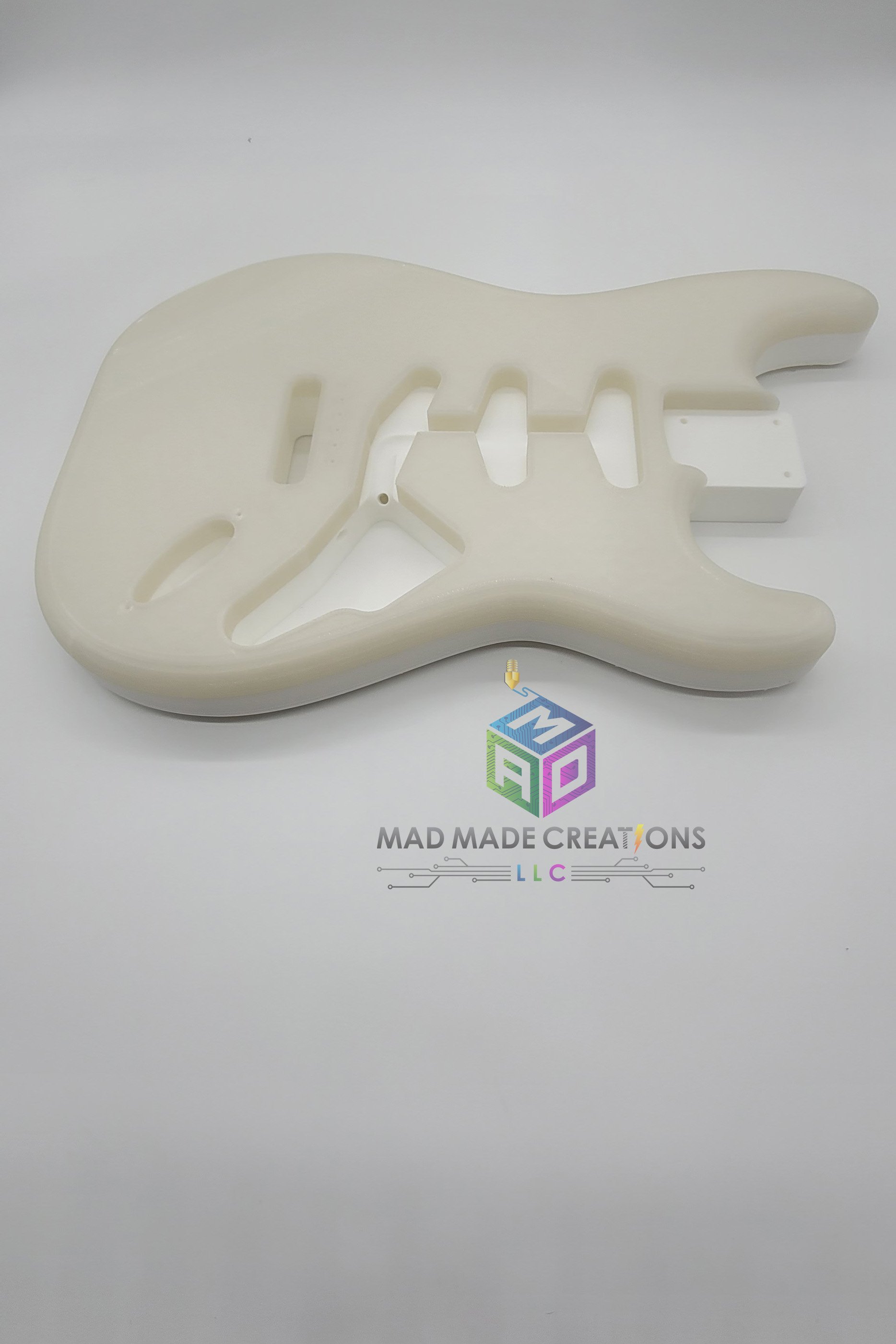 Side view of Strat SSS style guitar body – custom one-piece 3D printed guitar body in blue glow-in-the-dark filament by MAD Made Creations
