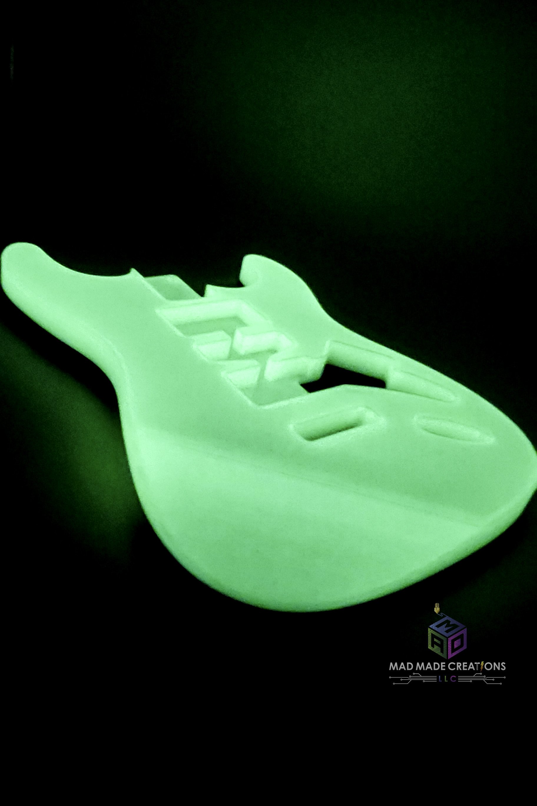 Close side view of glow-in-the-dark Strat HSH style 3D printed guitar body with modern 2-post tremolo mount, custom-crafted by MAD Made Creations