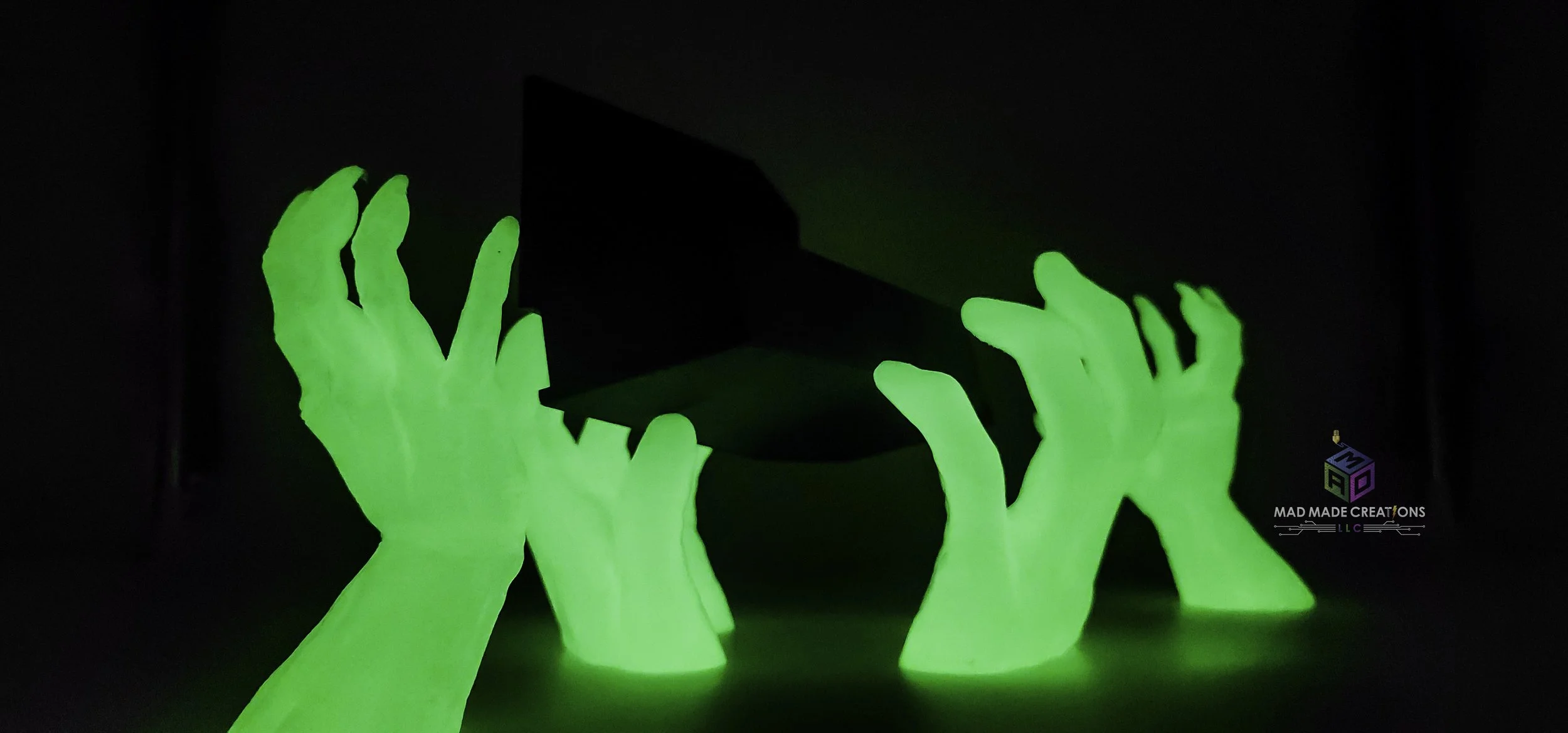 3D printed glow-in-the-dark human ghost hands holding a black Halloween coffin dish, spooky decor by MAD Made Creations