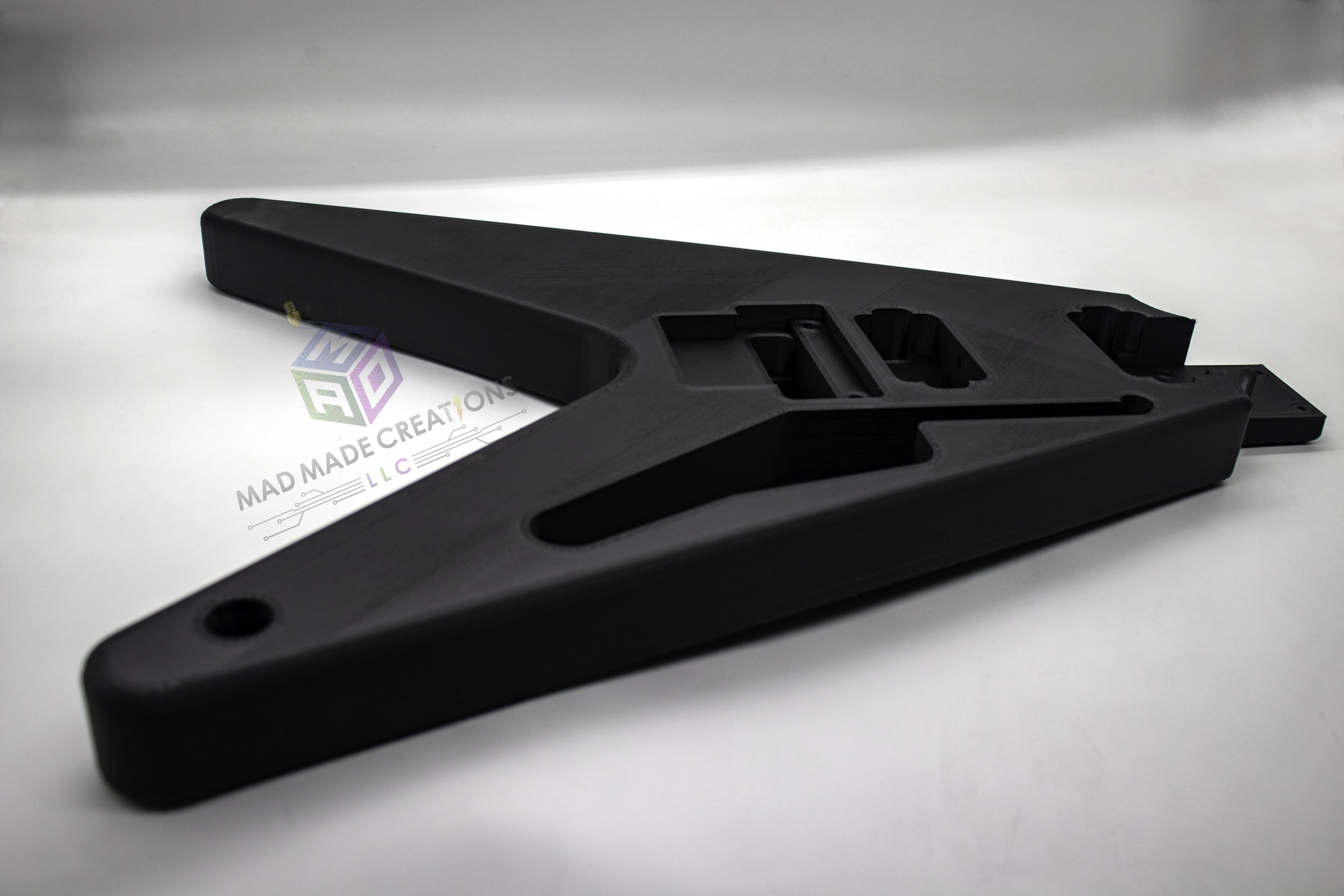 Top angled side view of 3D printed 1983 Flying V guitar body in black, featuring HH pickup routing and Floyd Rose compatibility, custom-designed by MAD Made Creations LLC