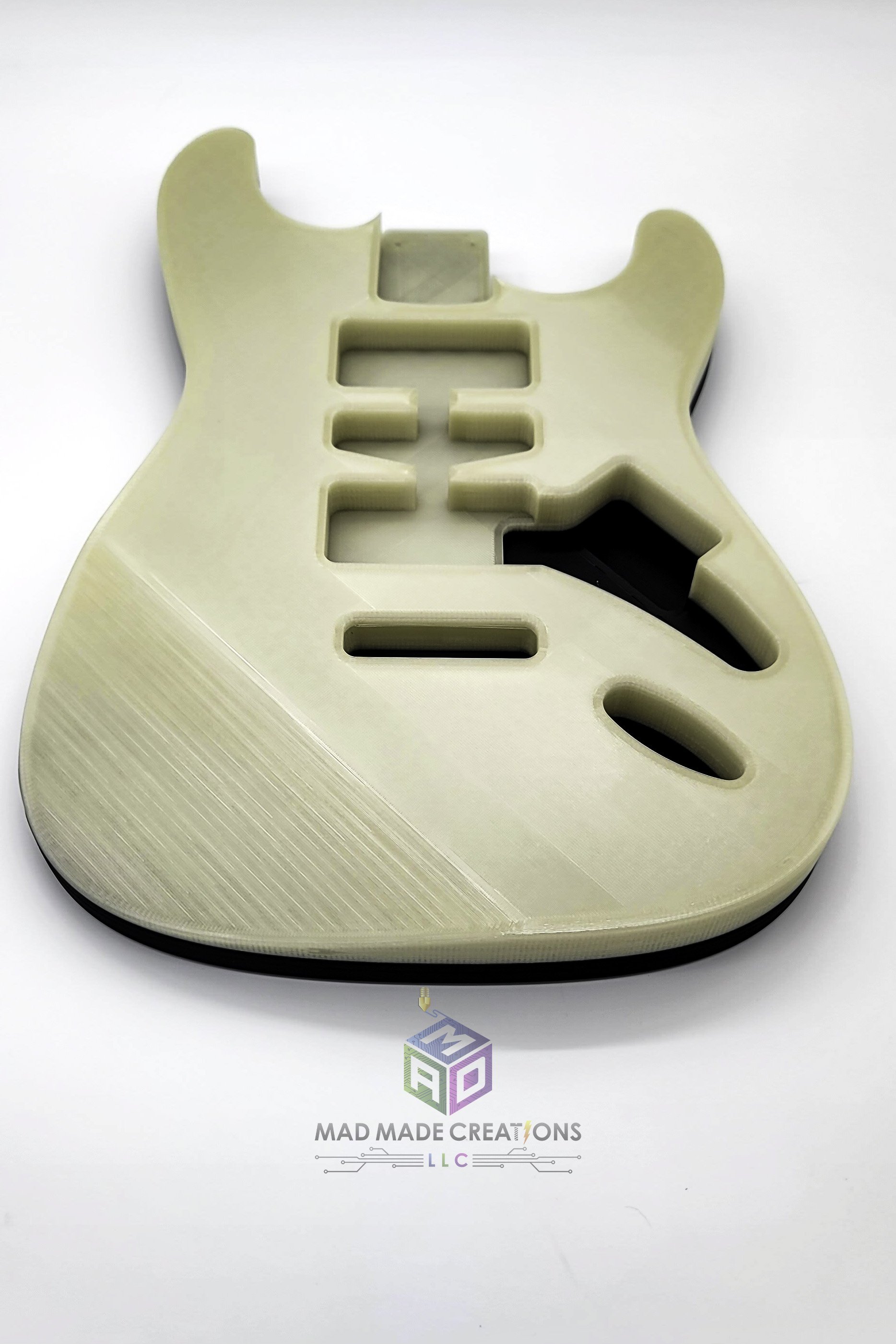 Front view of Strat HSH style custom guitar body 3D printed in glow-in-the-dark filament with modern Fender-style 2-post tremolo mounting by MAD Made Creations