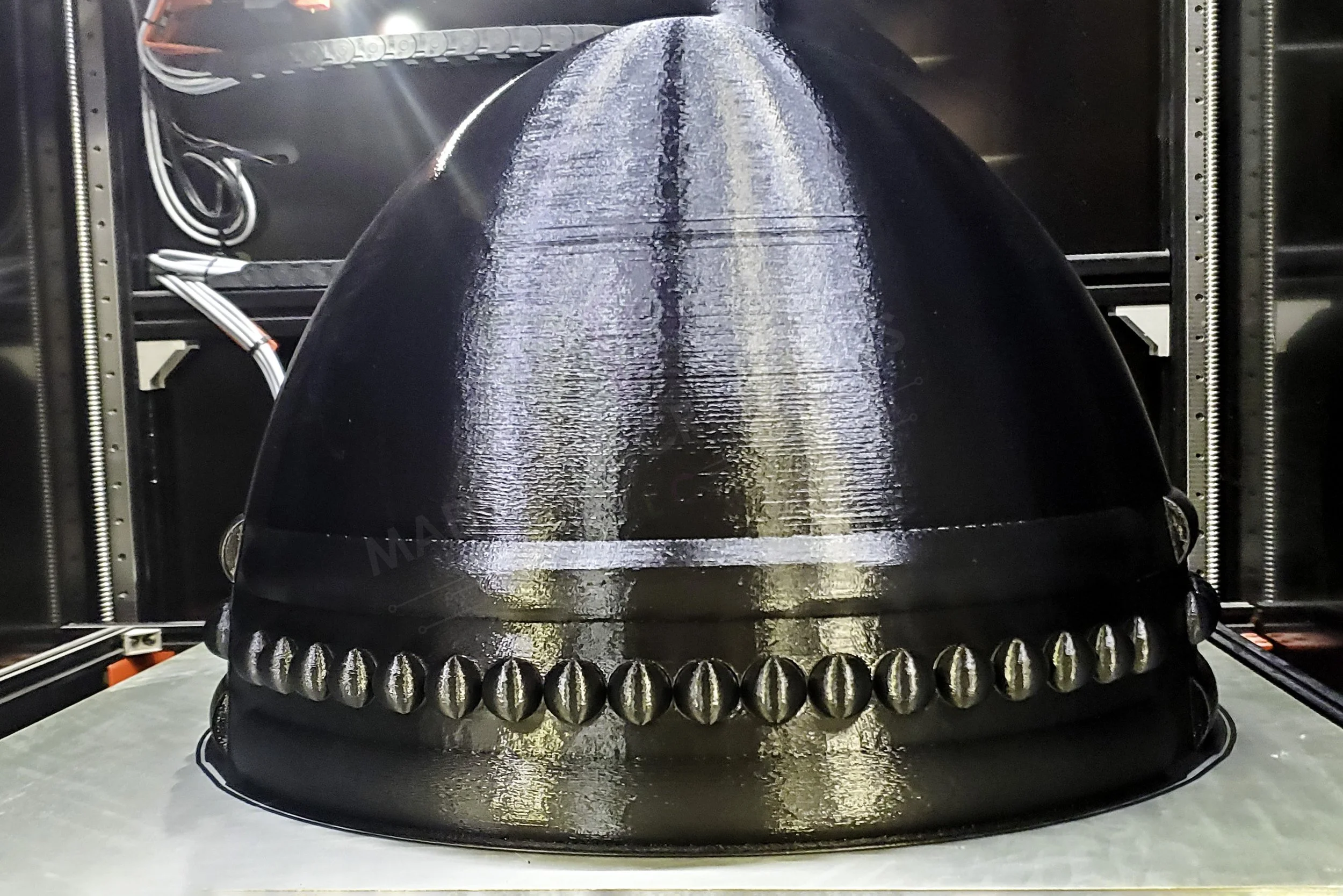 Large-format 3D printed black ABS brazier bowl prop by MAD Made Creations on the printer bed, front view