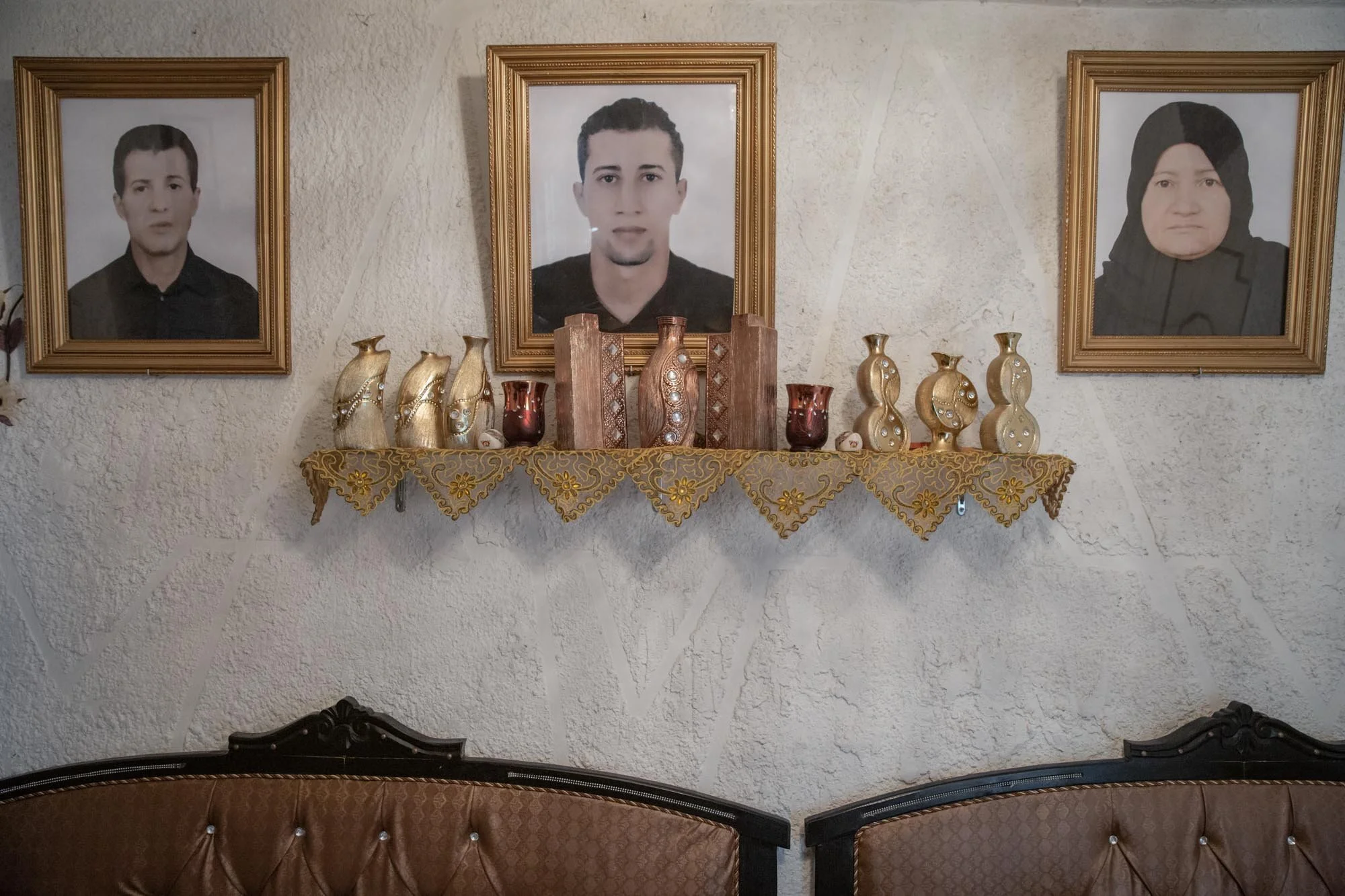 A portrait of Mohammad (center), who left Tunisia to join an extremist group in Syria and never returned, hangs in his family’s house in the Ettadhamen neighborhood of Tunis