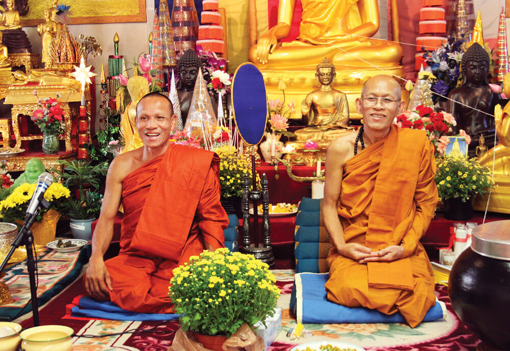 Morganton’s resident monk, Somchit Sengdavone (left) with an elder visiting monk, the Venerable Jhiteeyanao. 