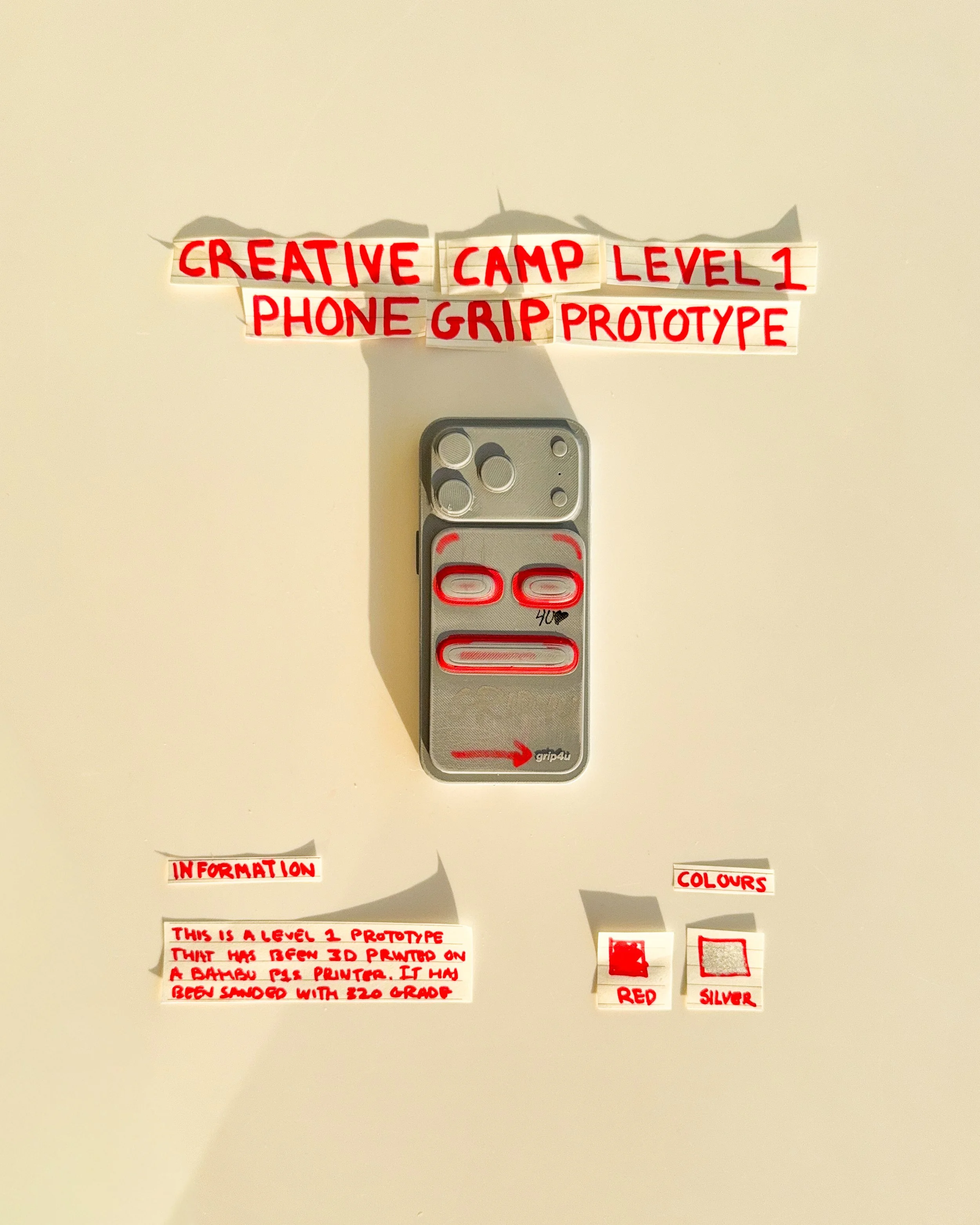 day 09: prototype 07. explore three horizontal grip openings arranged vertically, experimenting with repeated shapes, spacing and alternative finger positions within a single rectangular phone attachment.