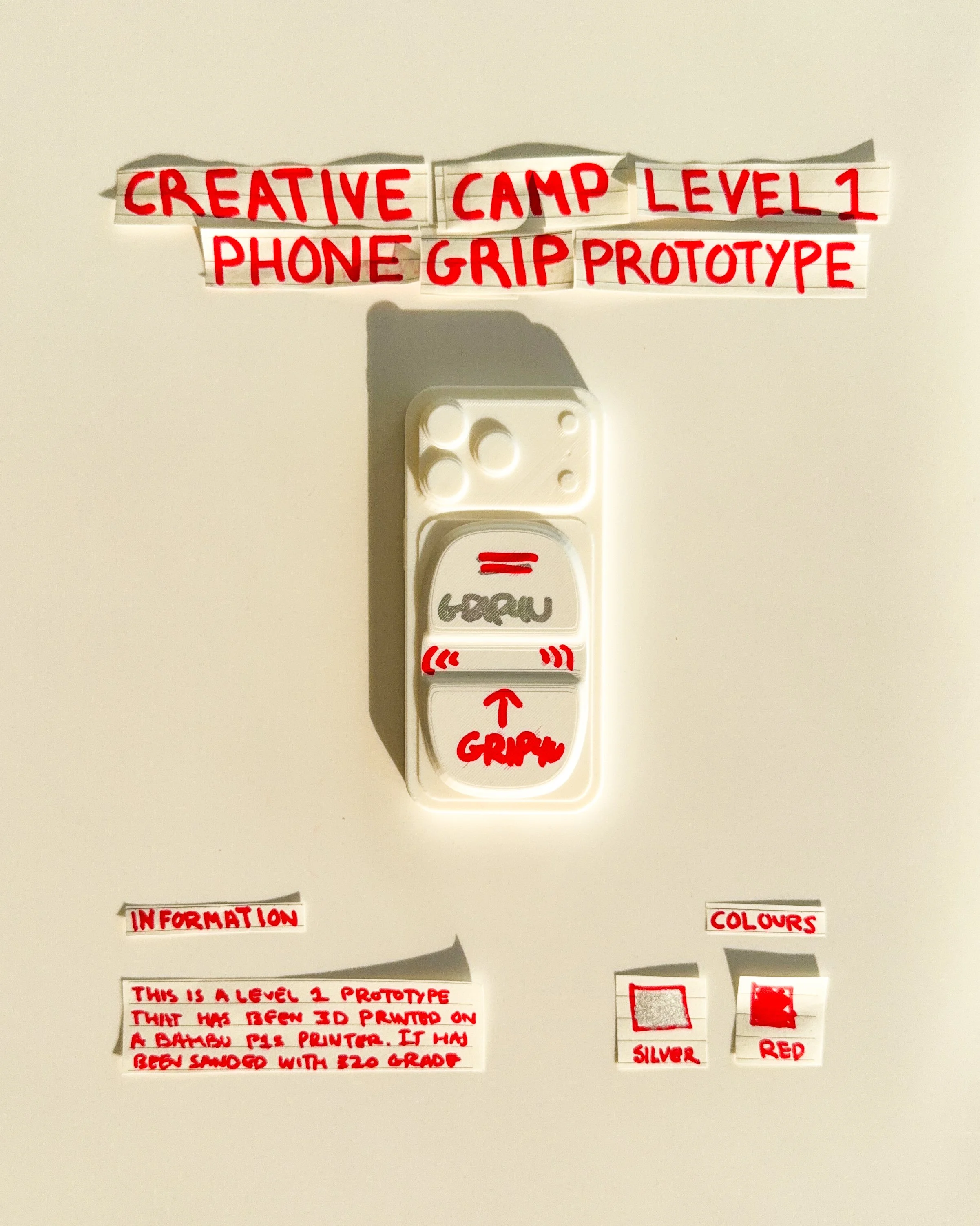 day 20 prototype 18: experiment with a white rectangular body, handwritten typography and a central finger opening. the design explores the relationship between colour, graphic placement and function.