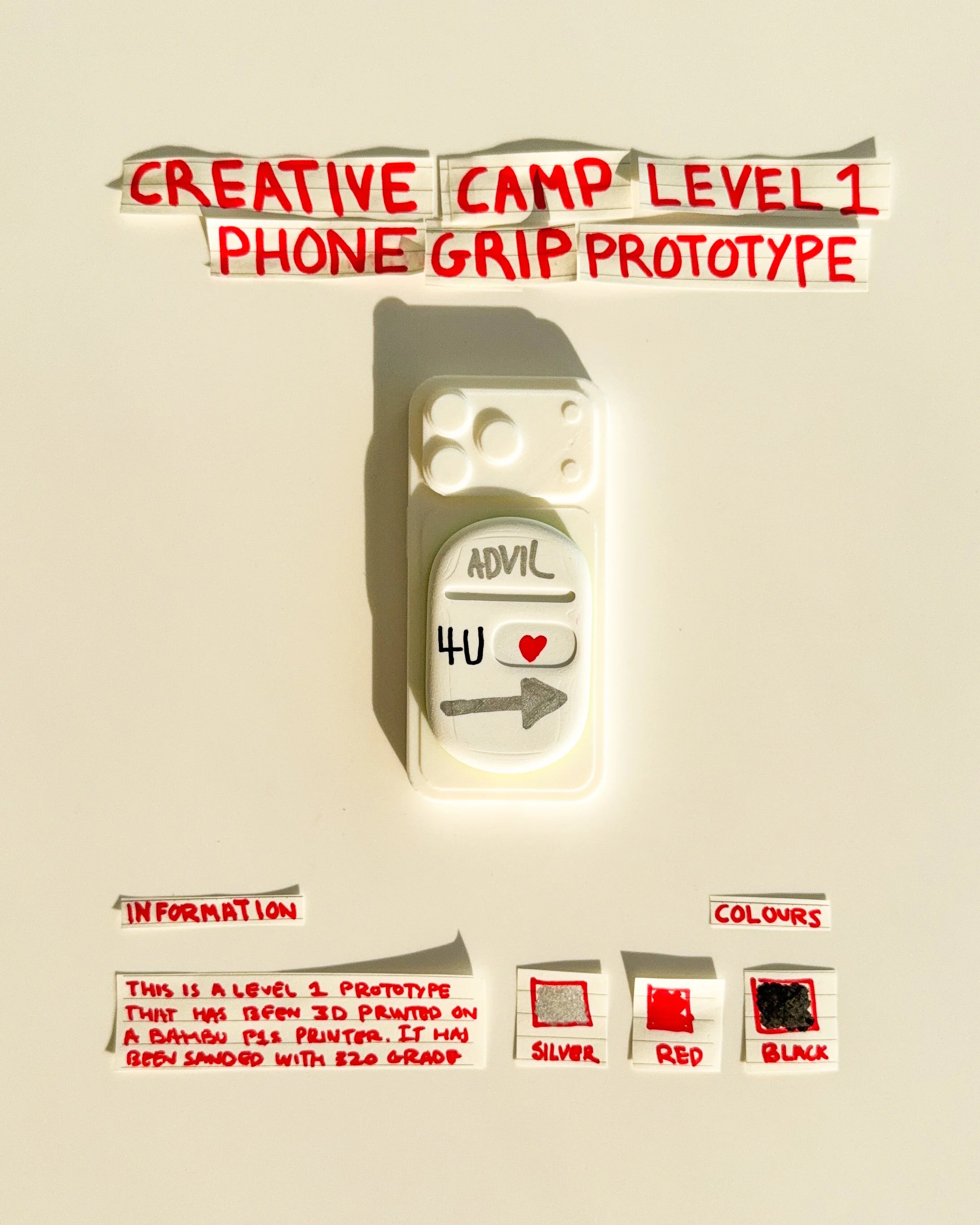 day 21 prototype 19: explore a white rectangular phone grip with handwritten typography, a small red heart and directional graphics. the design combines a simplified shape with expressive details and a playful visual identity.