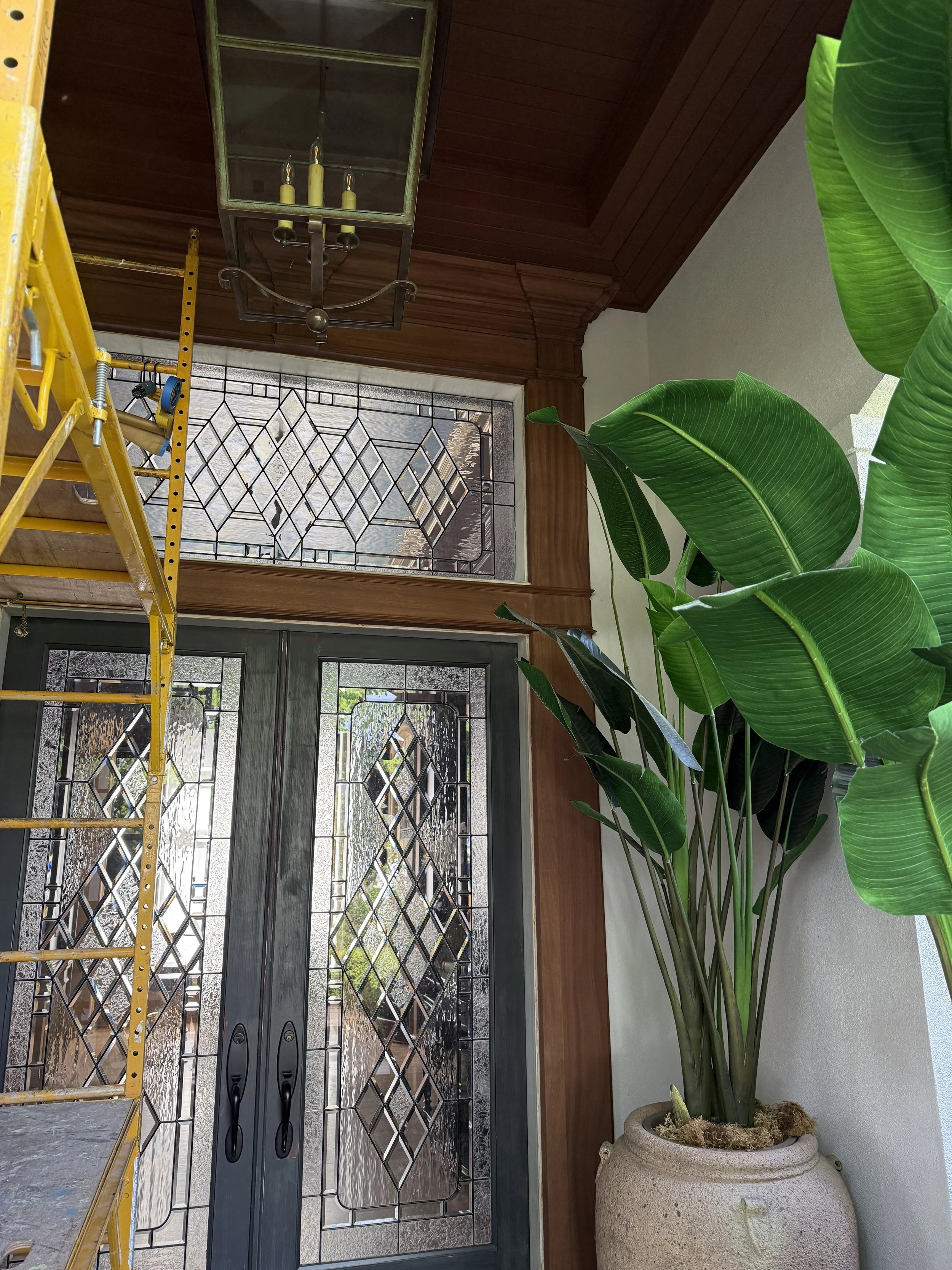 Exterior entry in progress. All of the woodwork was built up around the door to create a much grander entry that mimics the interior entry.