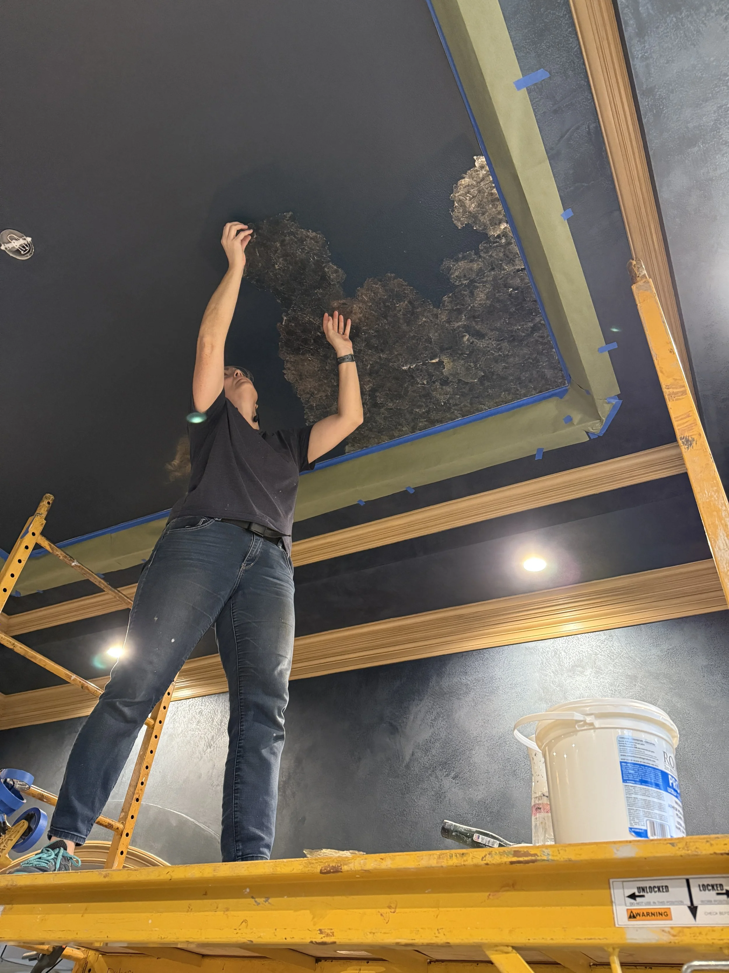 Applying Mica to the ceiling.