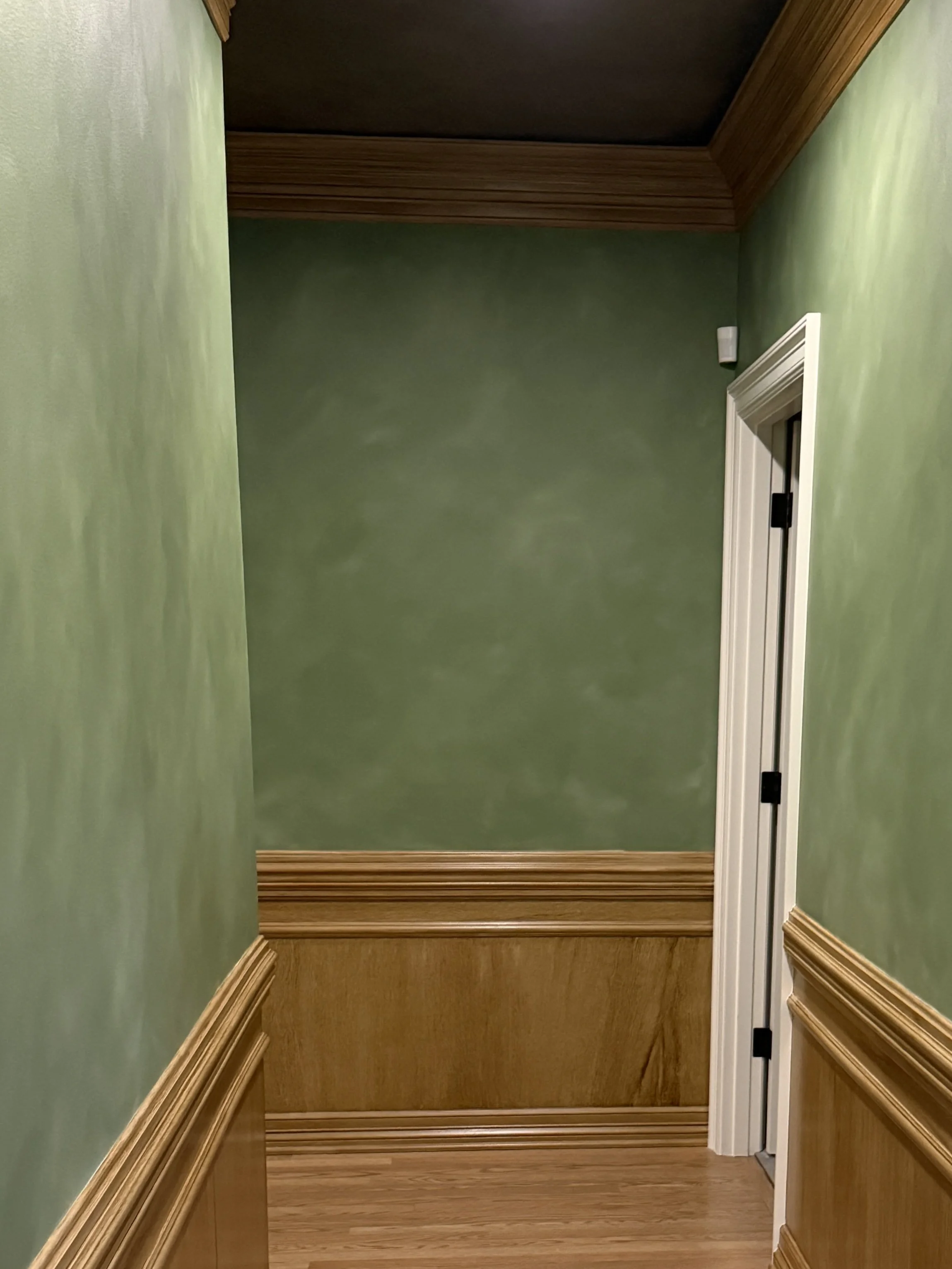 Hallway after. Faux woodwork, Lime washed walls, aged brass ceiling.