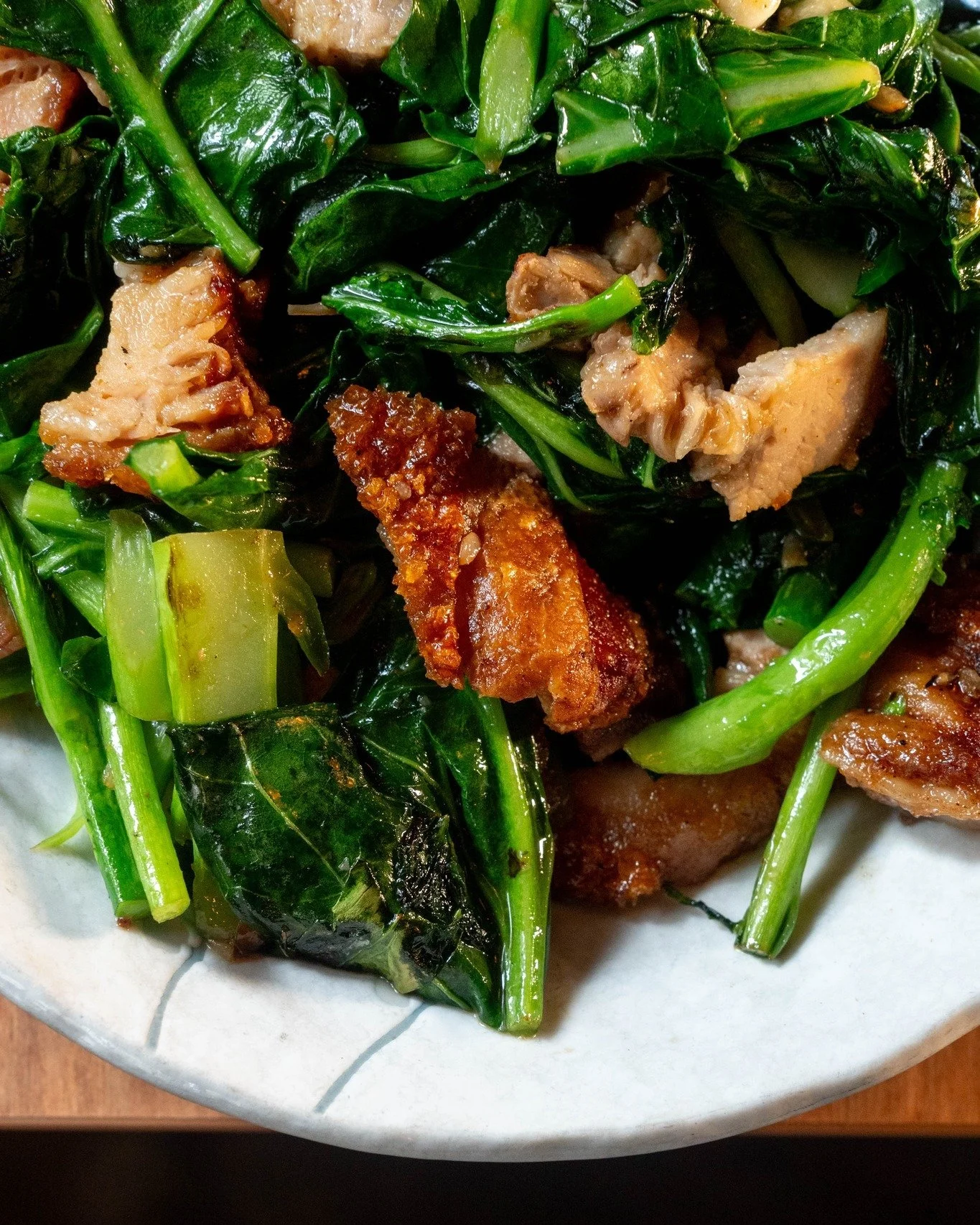 When golden pork belly meets wok-fired greens.
