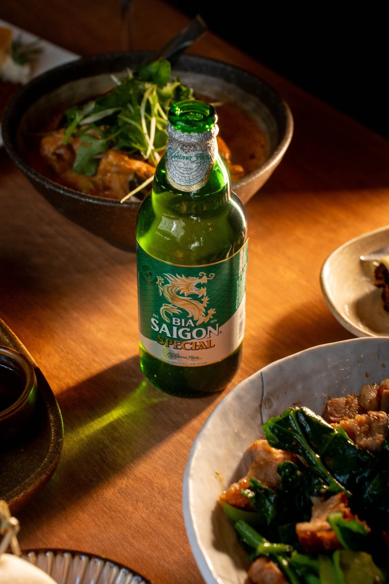 Feast complete? Only with a Saigon Bia in hand. 🍺