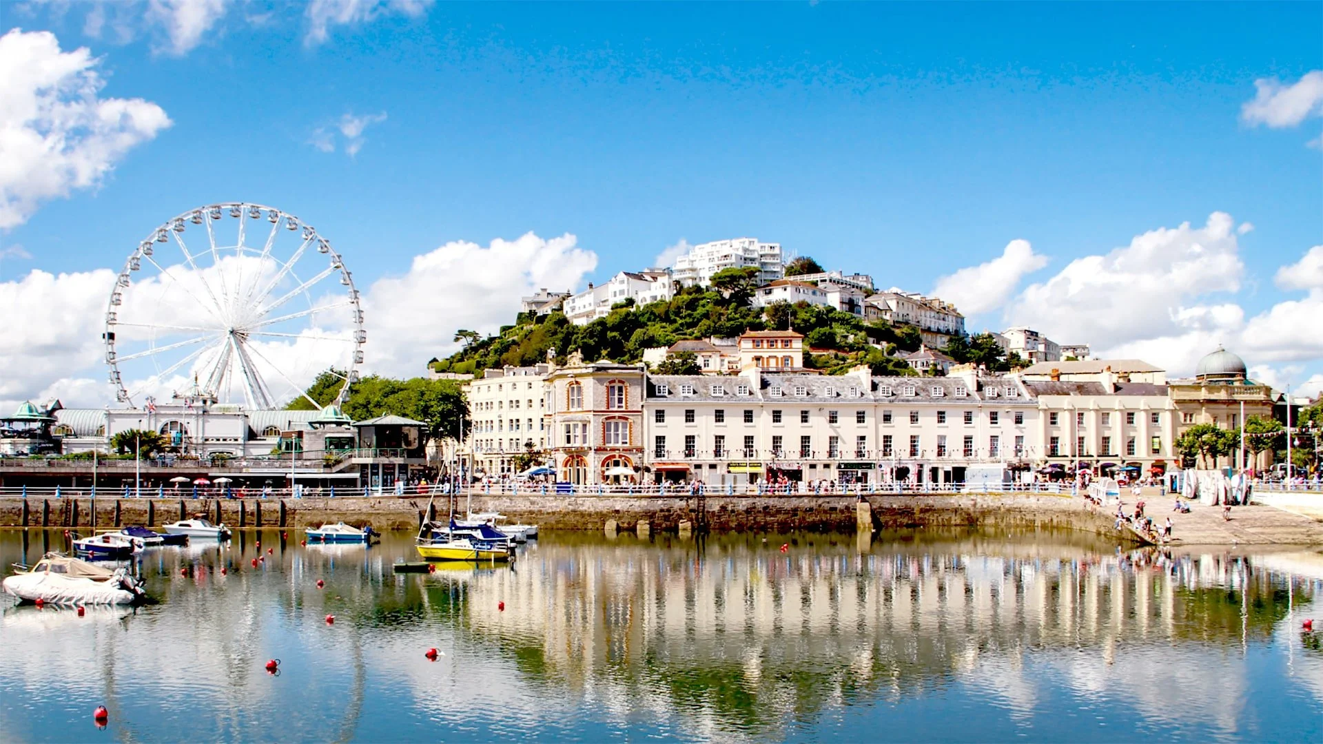 This image is clickable. Torquay harbor picture with big wheel