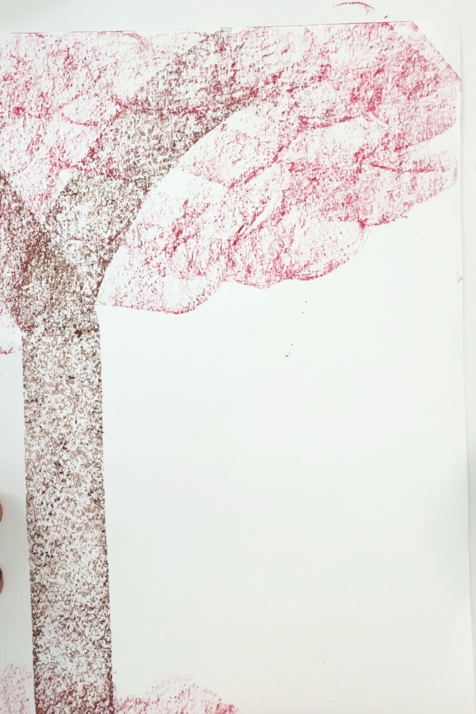 impressionist fall tree drawn with red and brown oil pastels on white paper