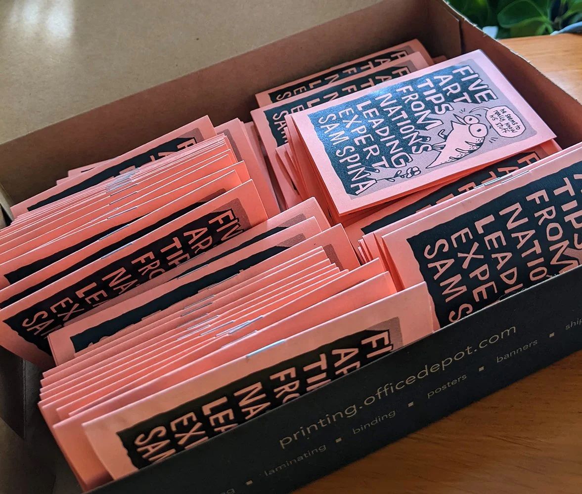 A photo of a box of the printed zines.