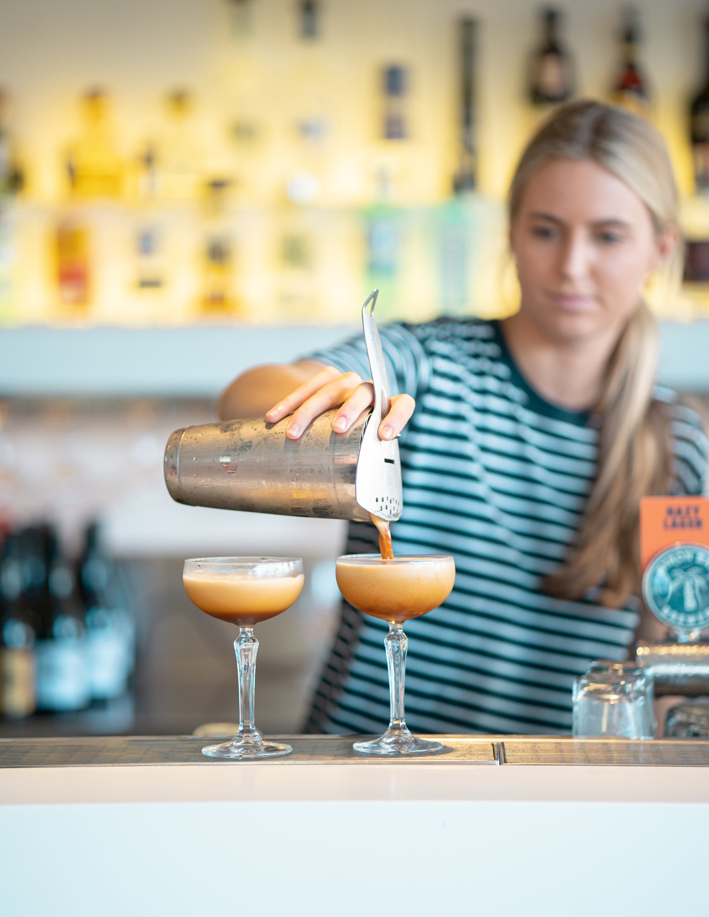 Bartender making espresso martinis