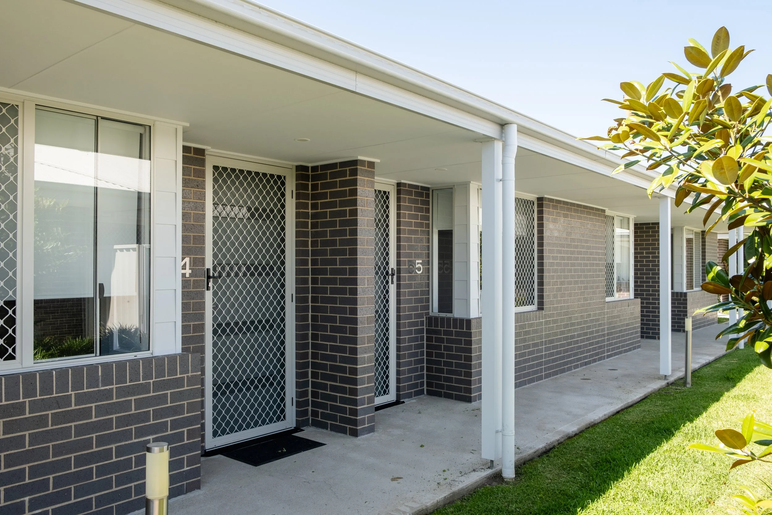 Front view of an over 55's villa  and garden