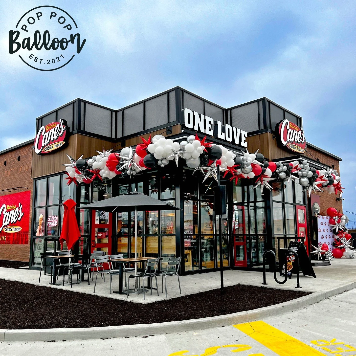 Custom red, white and black balloon installation for the Raising Cane’s grand opening in Fort Wayne.