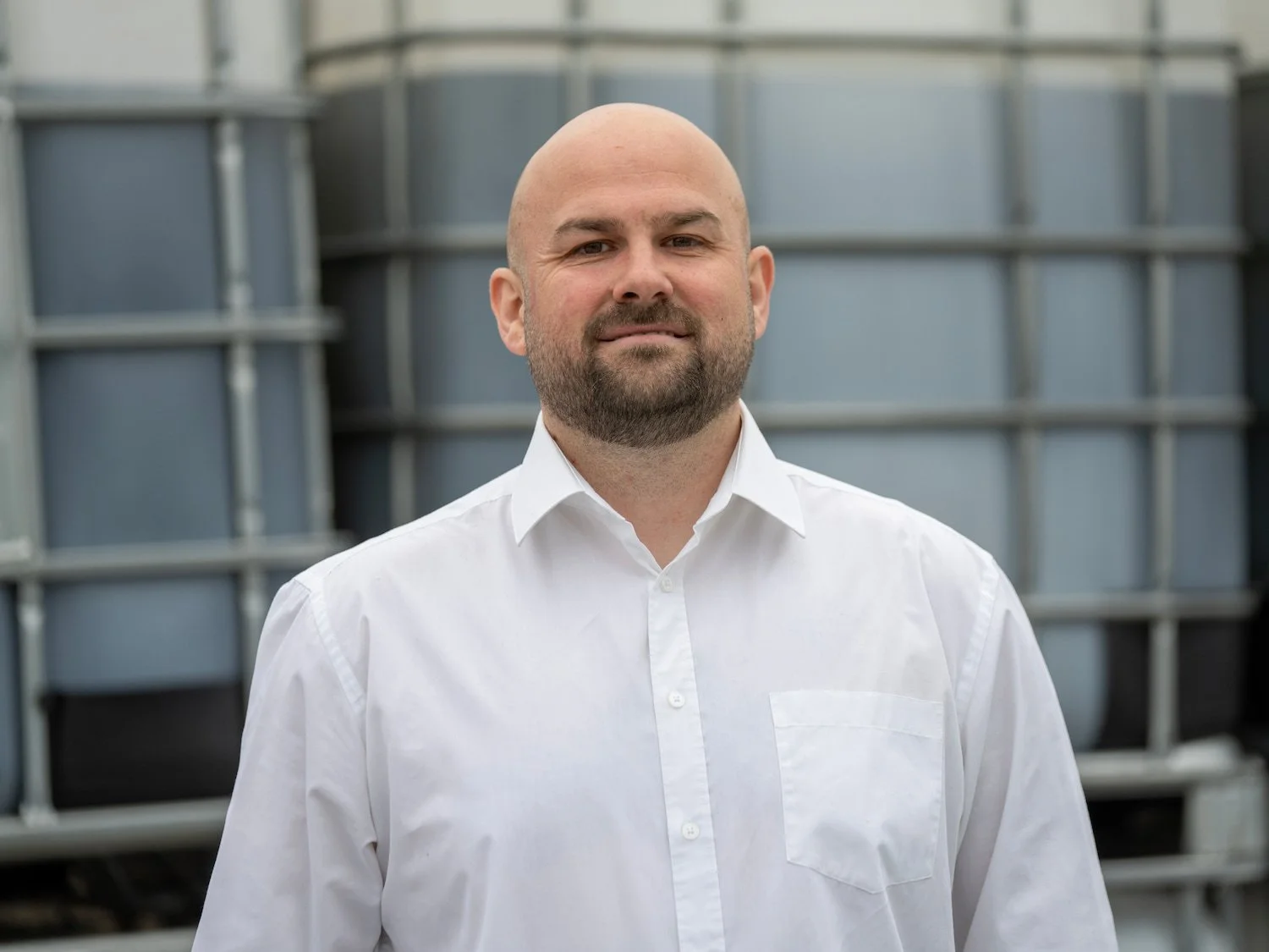 Jamie Holmes, Regional Sales Manager North West at Castle Environmental, smiling in a white shirt at the Ilkeston site