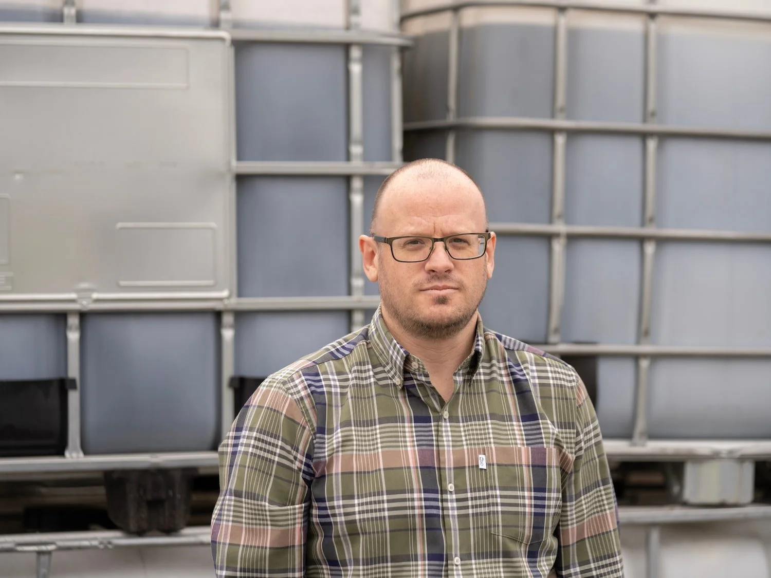 Matt Lovesy, Logistics and Customer Service Manager at Castle Environmental, wearing glasses and a checked shirt