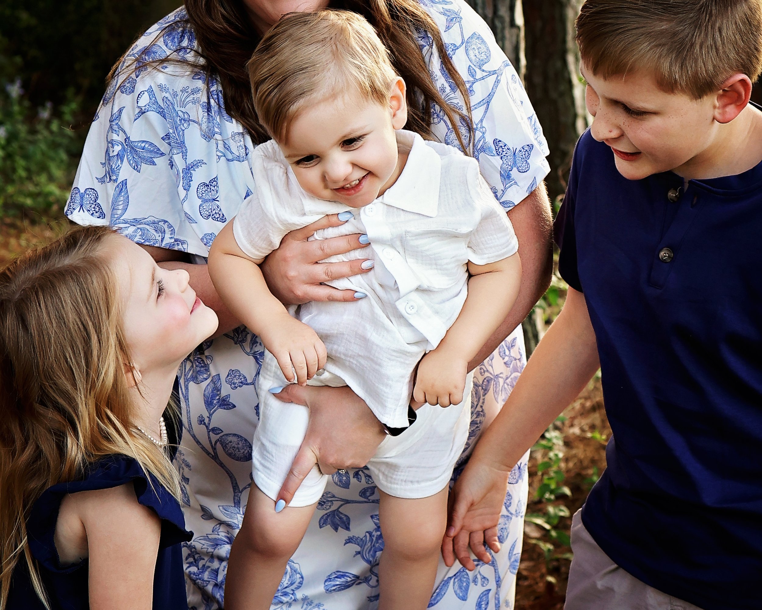 Three siblings. Three little personalities. One beautiful piece of childhood frozen in time.