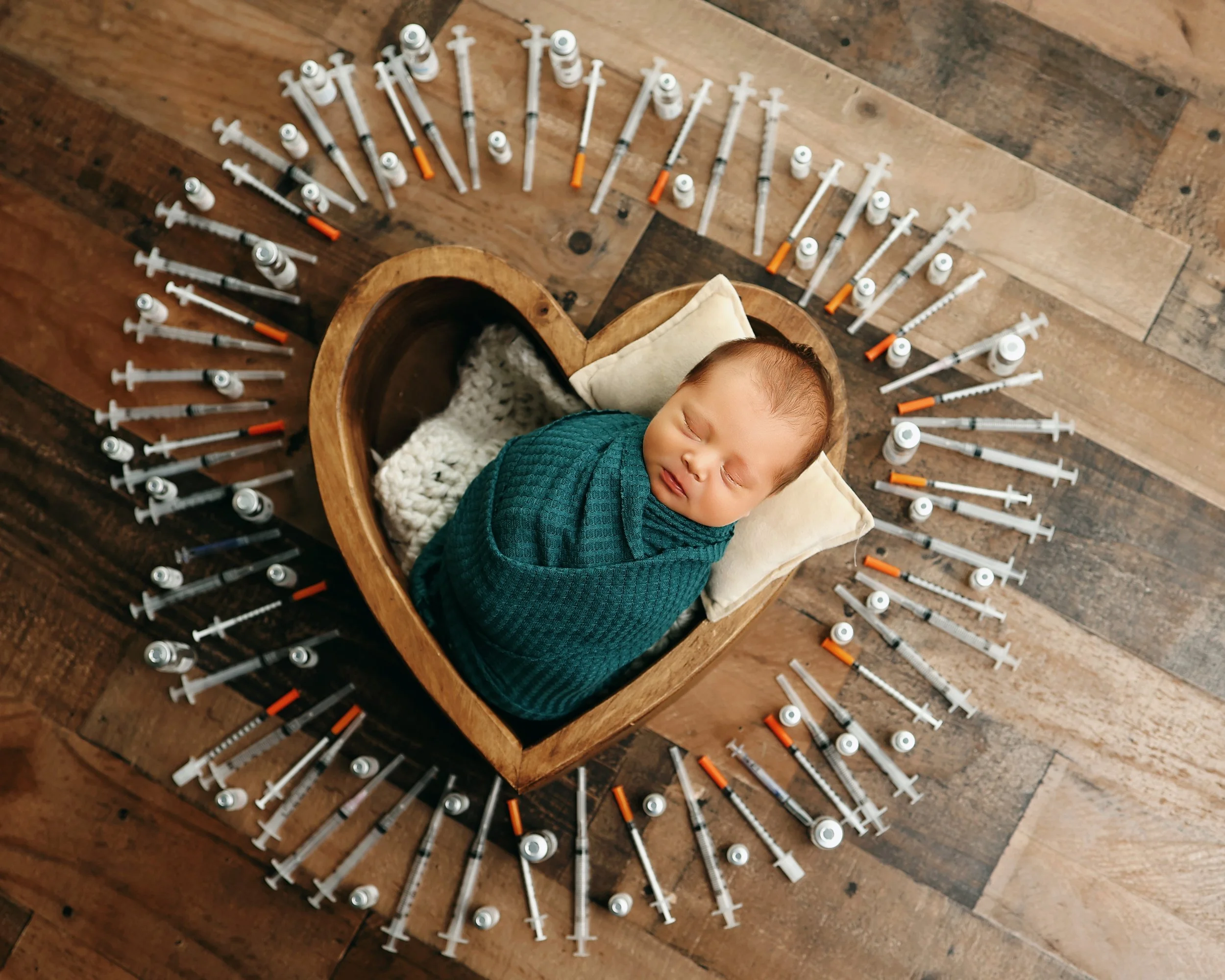 infertility-ivf-syringes-baby-in-heart-bowl-newborn-photography.jpg