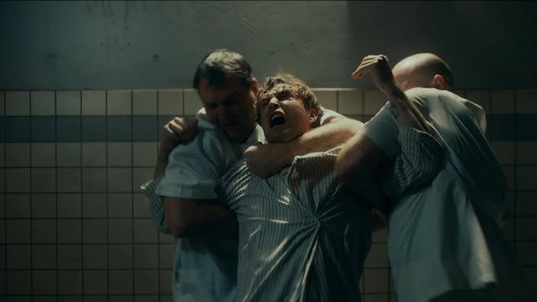 THE PLASTIC MEN (2025) orderlies restrain