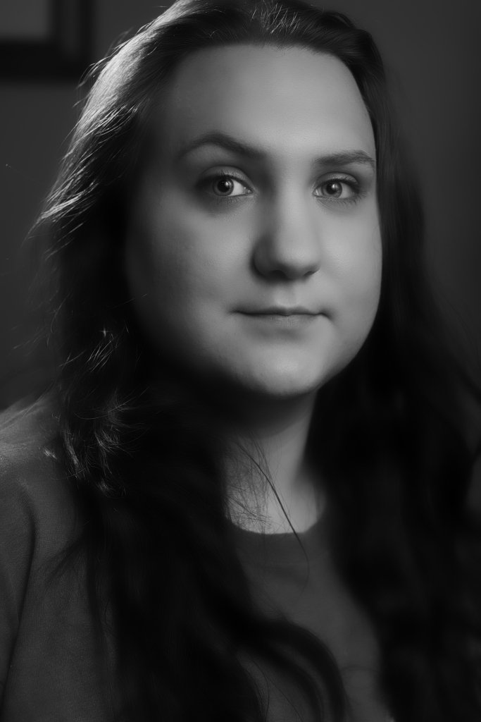 Young woman looking directly into the camera, black and white
