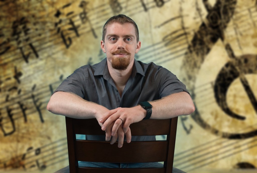 Man sitting with music notes in the background