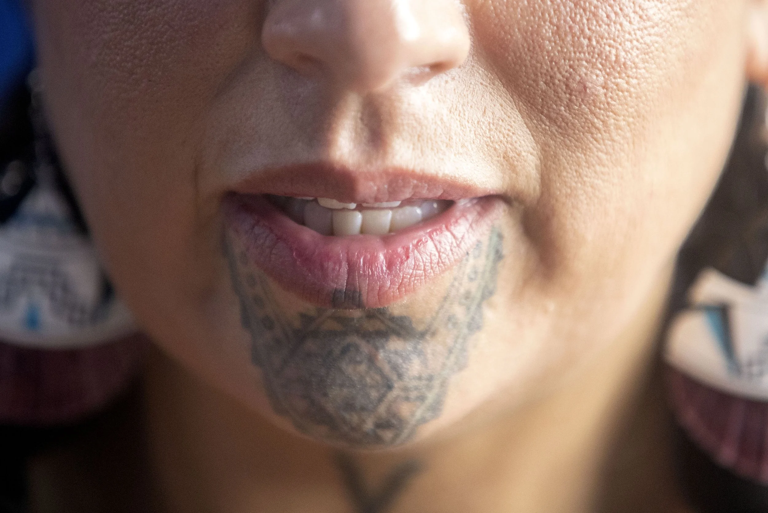  Stephanie Big Eagle speaks with client Erica Jaree as she tattoos Jaree's hands Thursday, Oct. 7, 2021 at Thunderbird Rising Studios in Indianapolis' Fountain Square neighborhood. Big Eagle said the process is often healing for her clients, who spen