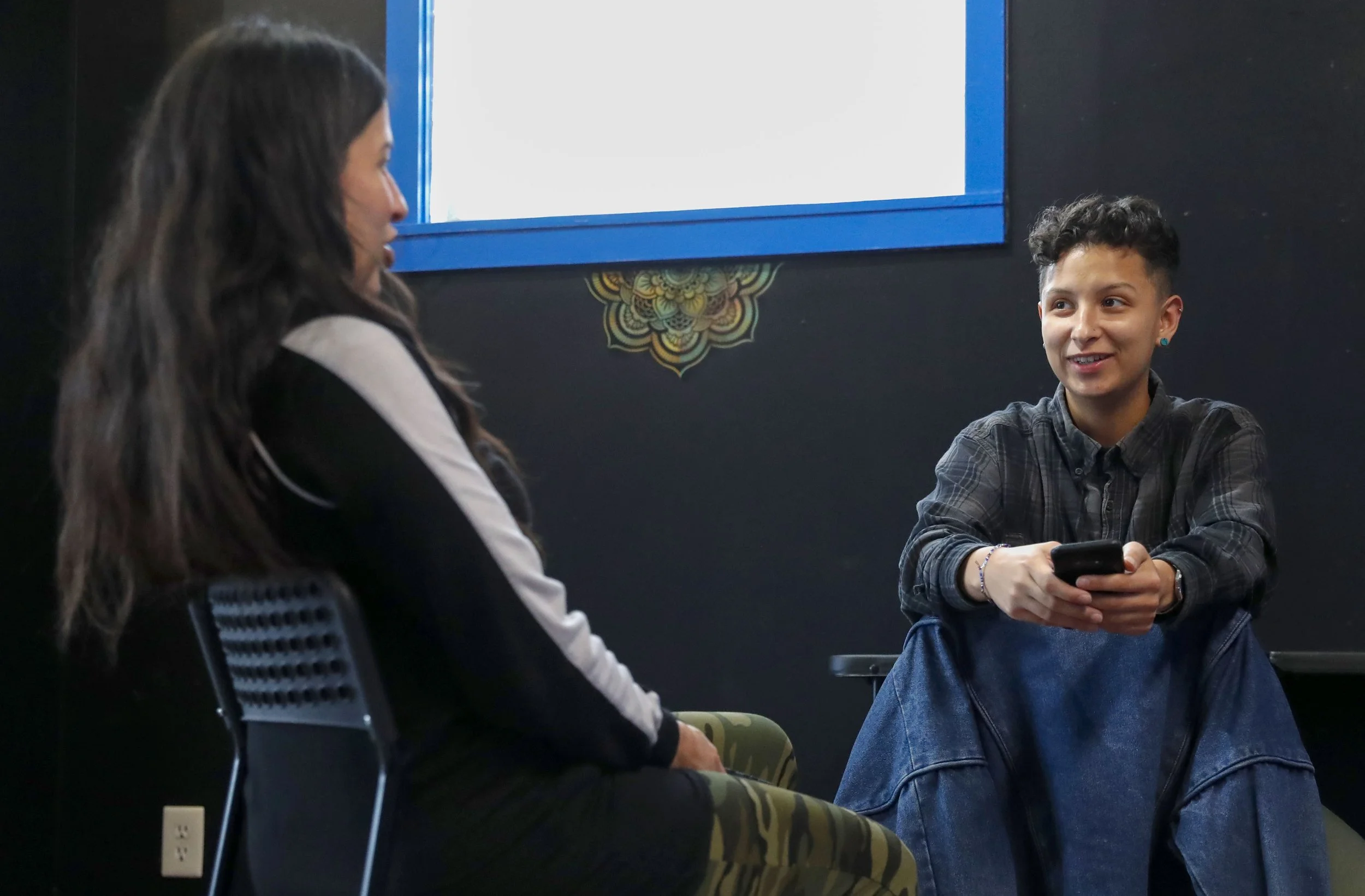  Stephanie Big Eagle speaks with her child Jo Long on Saturday, Nov. 13, 2021 at Thunderbird Rising Studios in Indianapolis' Fountain Square neighborhood. Long is on their own journey of cultural reconnection and considers Big Eagle a teacher. 