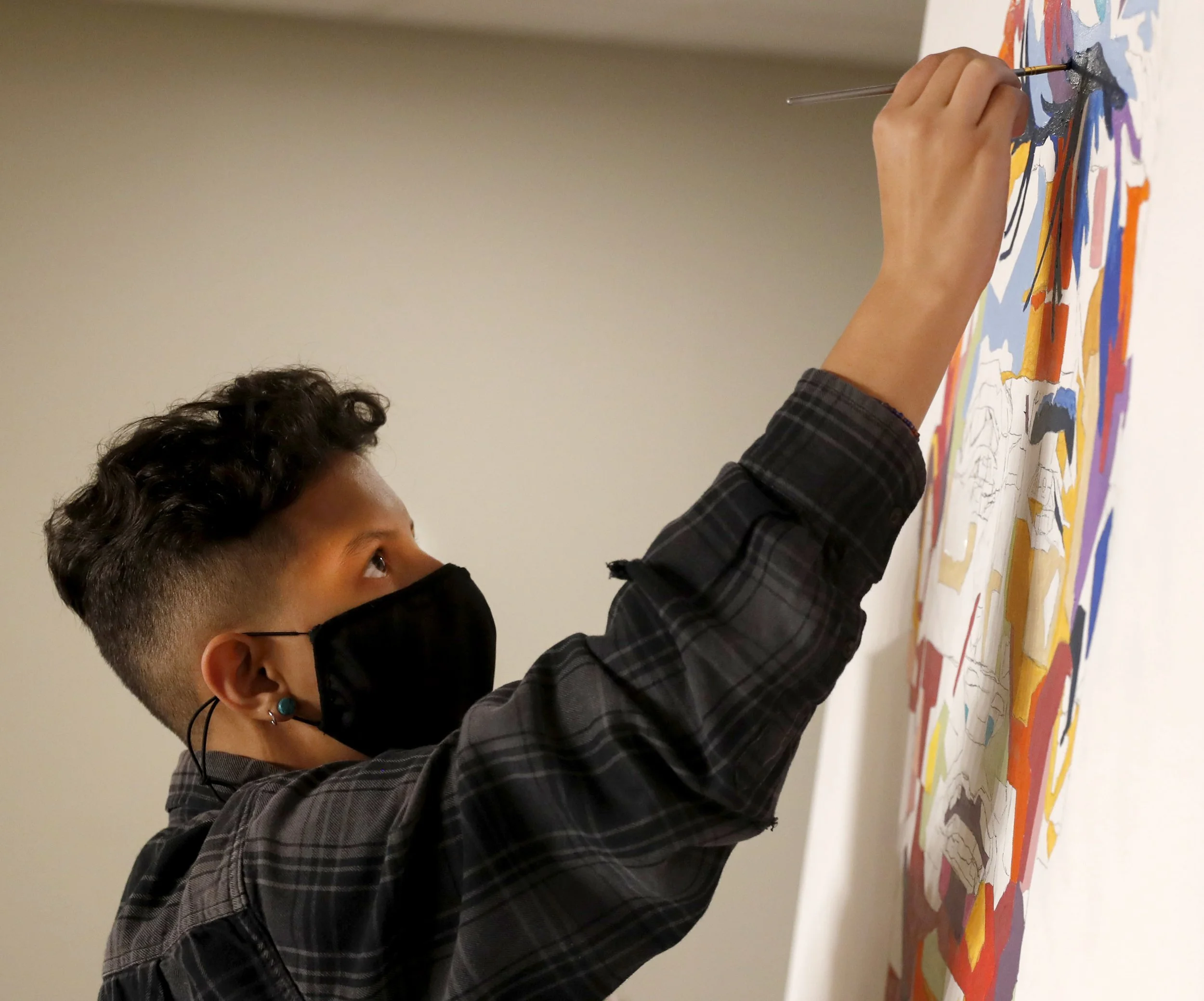  Jo Long helps paint a portrait of Jim Thorpe during an event sponsored by the First Nations Educational and Cultural Center on Tuesday, Nov. 8, 2021 at Indiana University Bloomington. Thorpe is the first Native American to win gold at the Olympics f