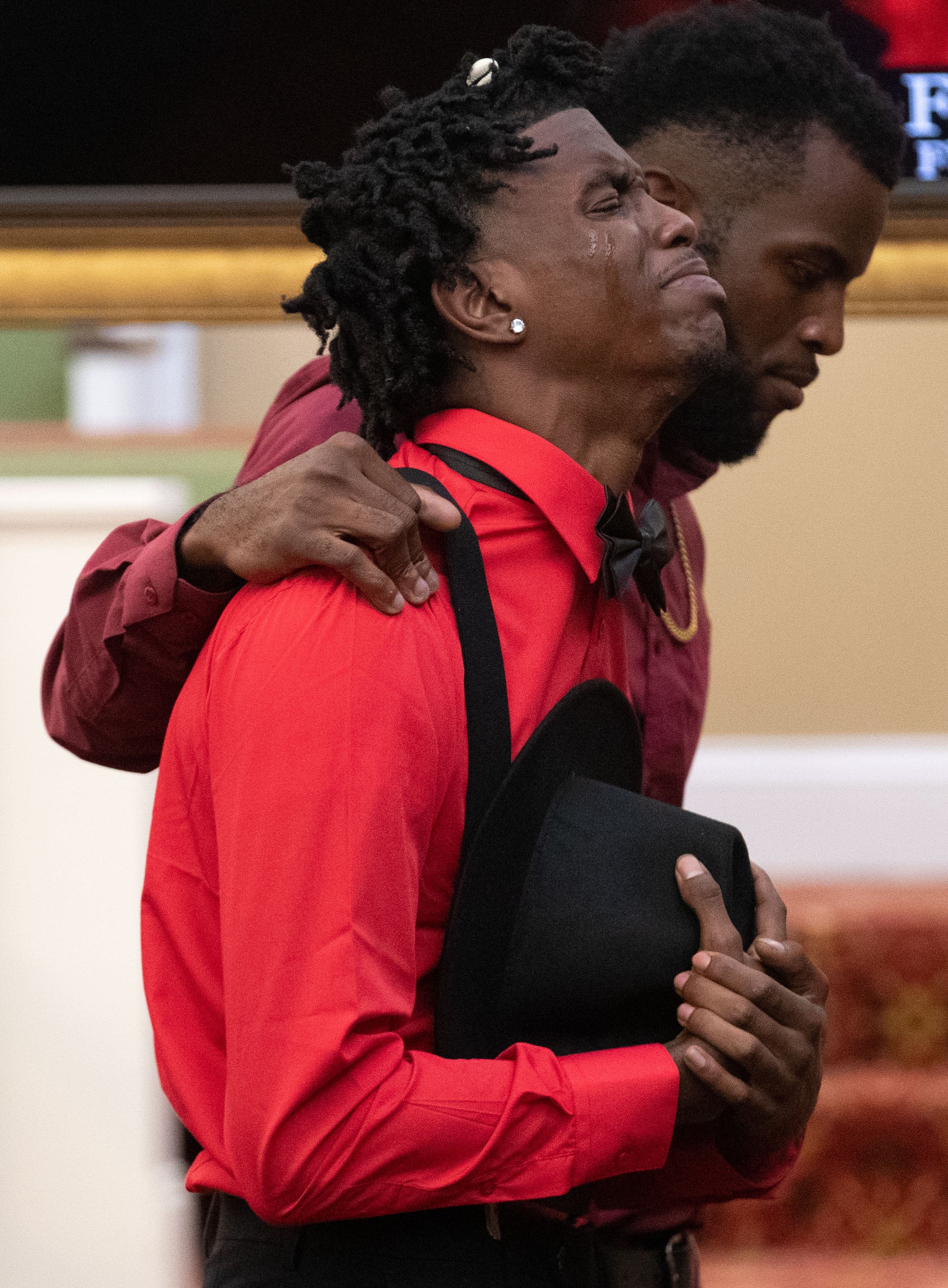  Danaye Seay, friend of Dewayne Tunstall, grieves after viewing Tustall’s casket during his funeral on Thursday, Sept. 15, 2022, in Memphis. Tunstall was killed during a shooting spree that left two others dead and three injured last Wednesday. “He w