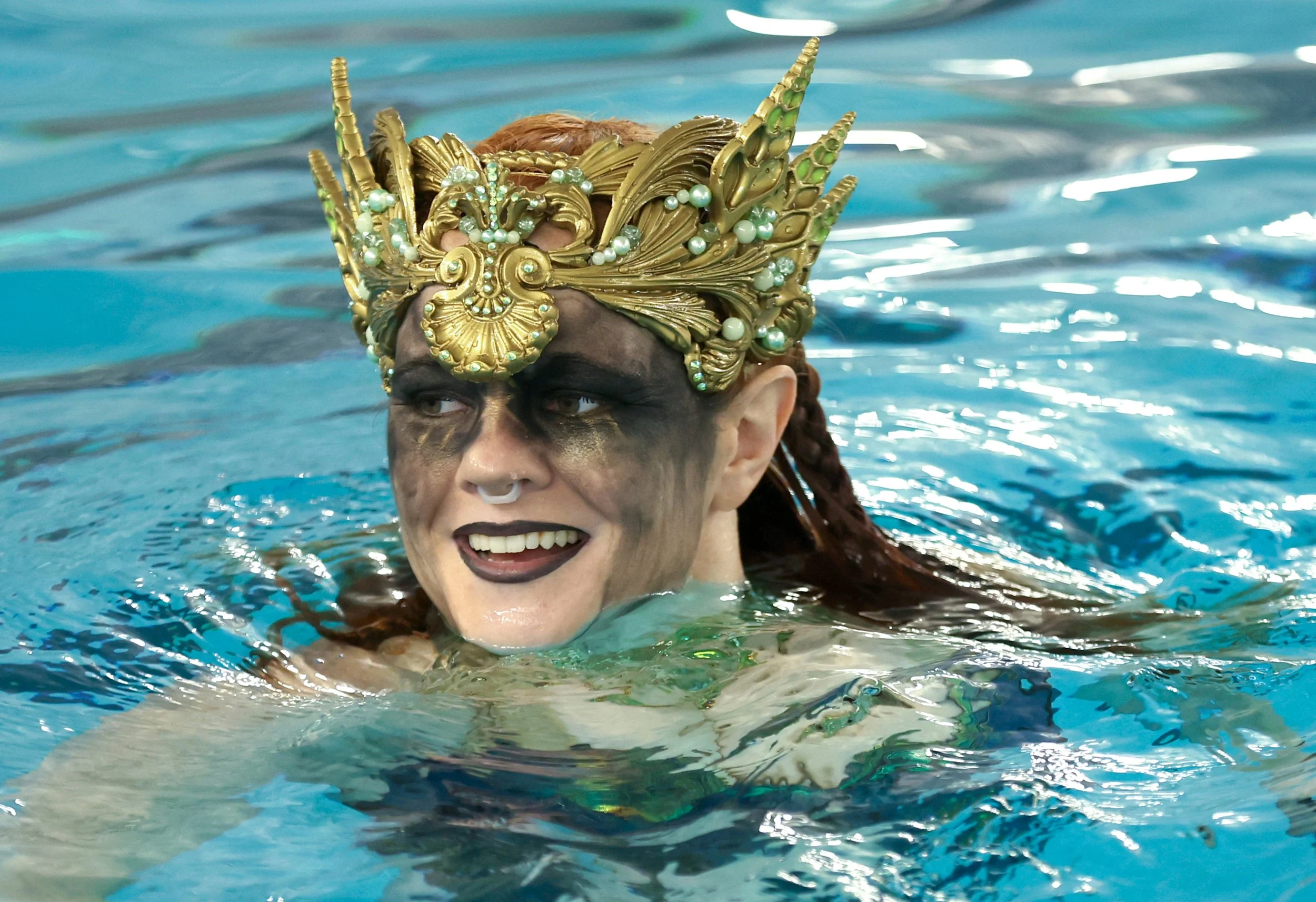  Sara Cooper swims Sunday, July 9, 2023, at McKendree Metro Rec Plex in O'Fallon, Ill. Members from the Downstate Illinois River Maidens and Missouri Mermaids pods met to swim in the pool. 