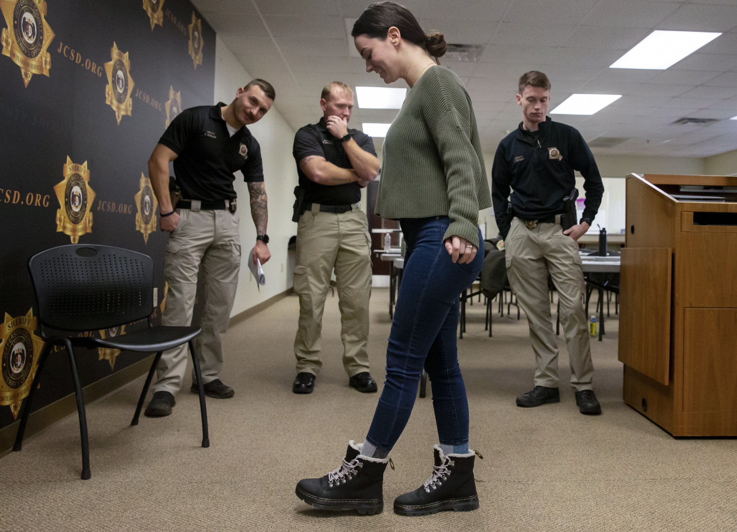  Sheriff's Deputies Kyle Mueller, left, Brock Bridges, center, and Nathaniel Brandt, right, watch as volunteer Alex Newton, front, takes a sobriety test Tuesday, Jan. 10, 2023, at the Jefferson County Sheriff's Office in Hillsboro. Instructors traine