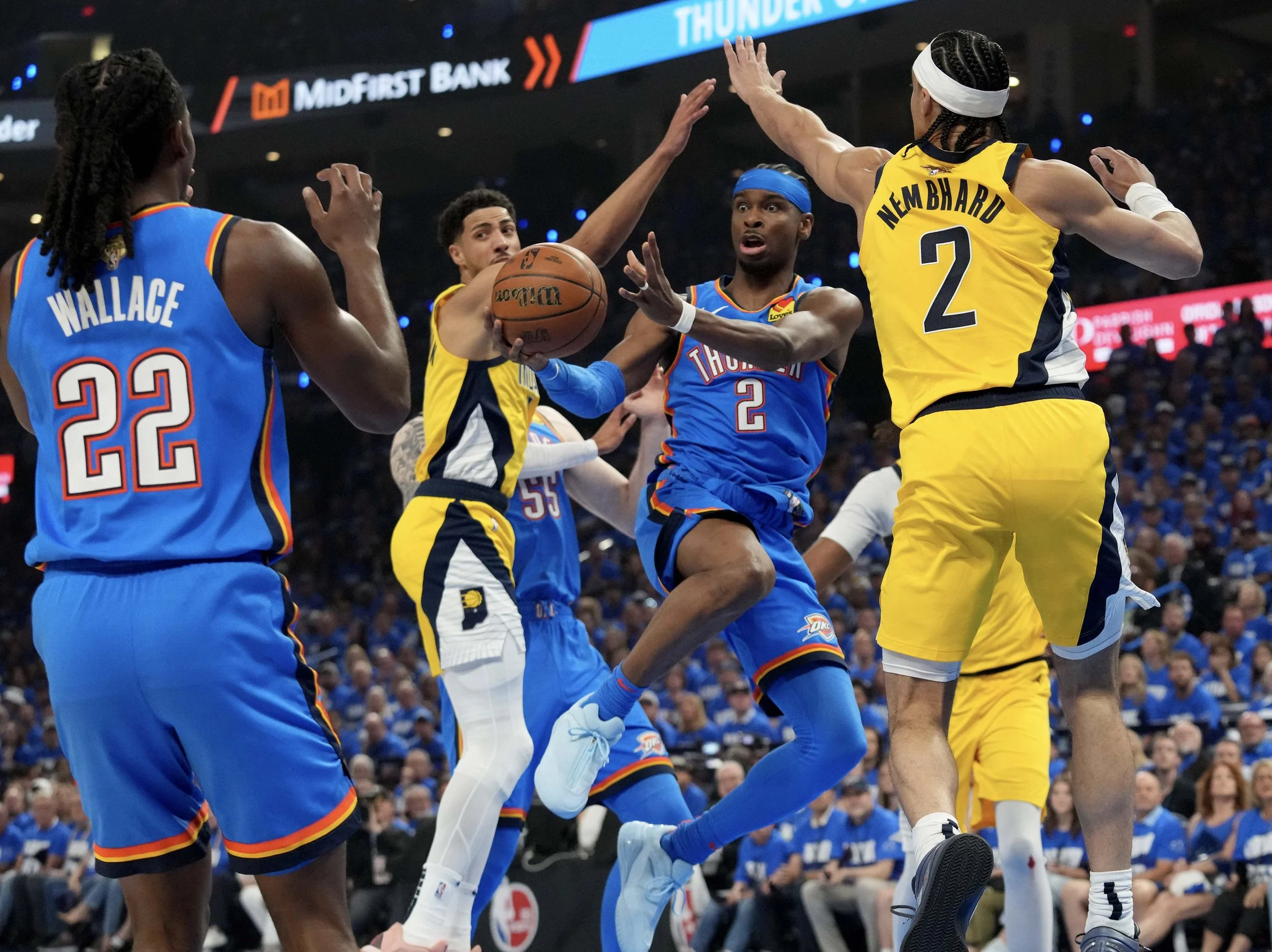  Oklahoma City Thunder guard Shai Gilgeous-Alexander (2) passes to guard Cason Wallace (22) Sunday, June 8, 2025, against the Indiana Pacers during Game 2 of the NBA Finals at Paycom Center in Oklahoma City. 