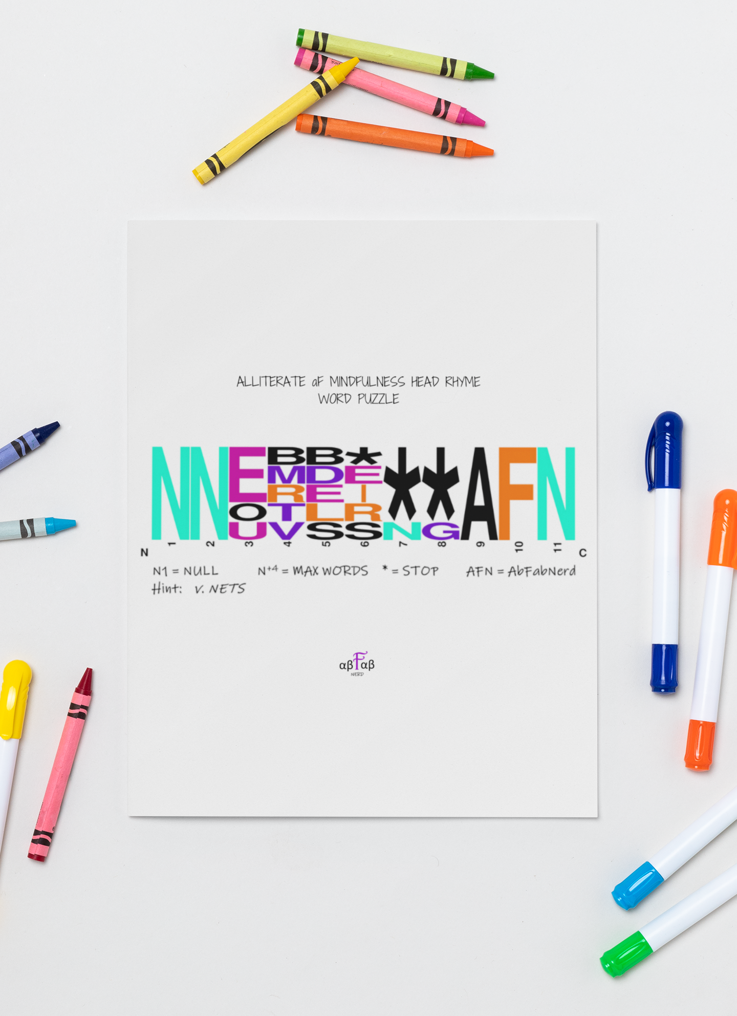 Printed word puzzle with colorful letters and notes about maximum words and stop symbols, surrounded by assorted colored markers on a white surface.