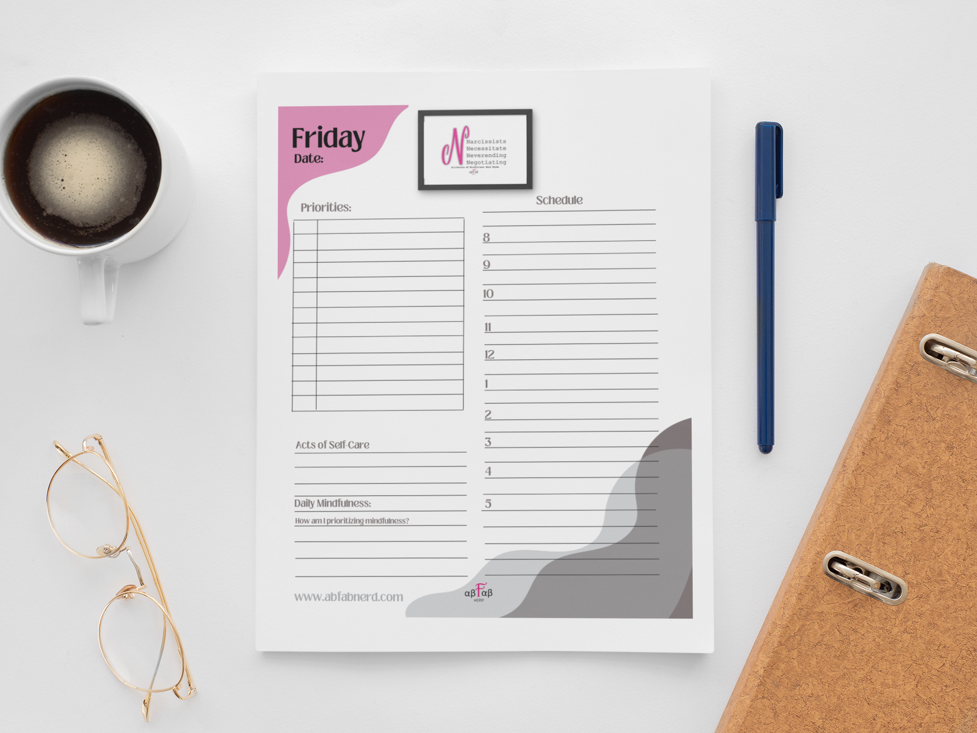 A white desk top with a cup of coffee, a pair of gold-rimmed glasses, a blue pen, a planner or schedule sheet, and a brown textured notebook.