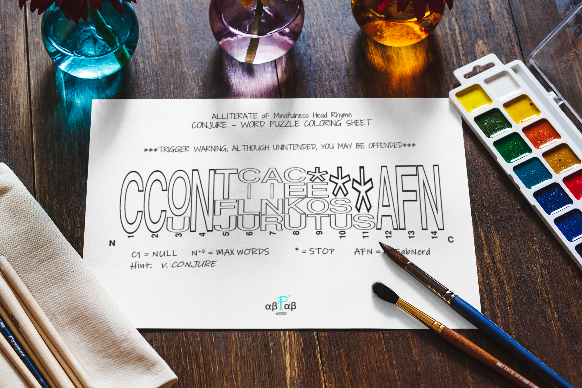 An adult coloring sheet titled 'Alliterate aF Mindfulness Head Rhyme Conjure - Word Puzzle Coloring Sheet' on a wooden desk with paintbrushes, watercolor palette, glasses of water, and a cloth napkin.