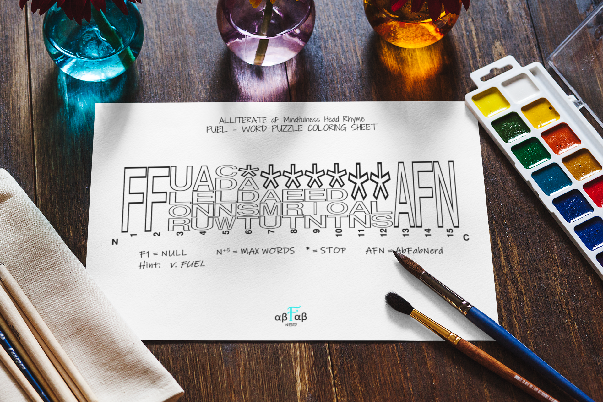 A worksheet titled 'ALLITERATE of Mindfulness Head Rhyme FUEL - WORD PUZZLE COLORING SHEET' with a word puzzle of the words 'FUEL,' 'FAD,' 'FEE,' and 'FLARE' in various fonts and sizes, and colorful watercolor paints next to paintbrushes on a wooden table.